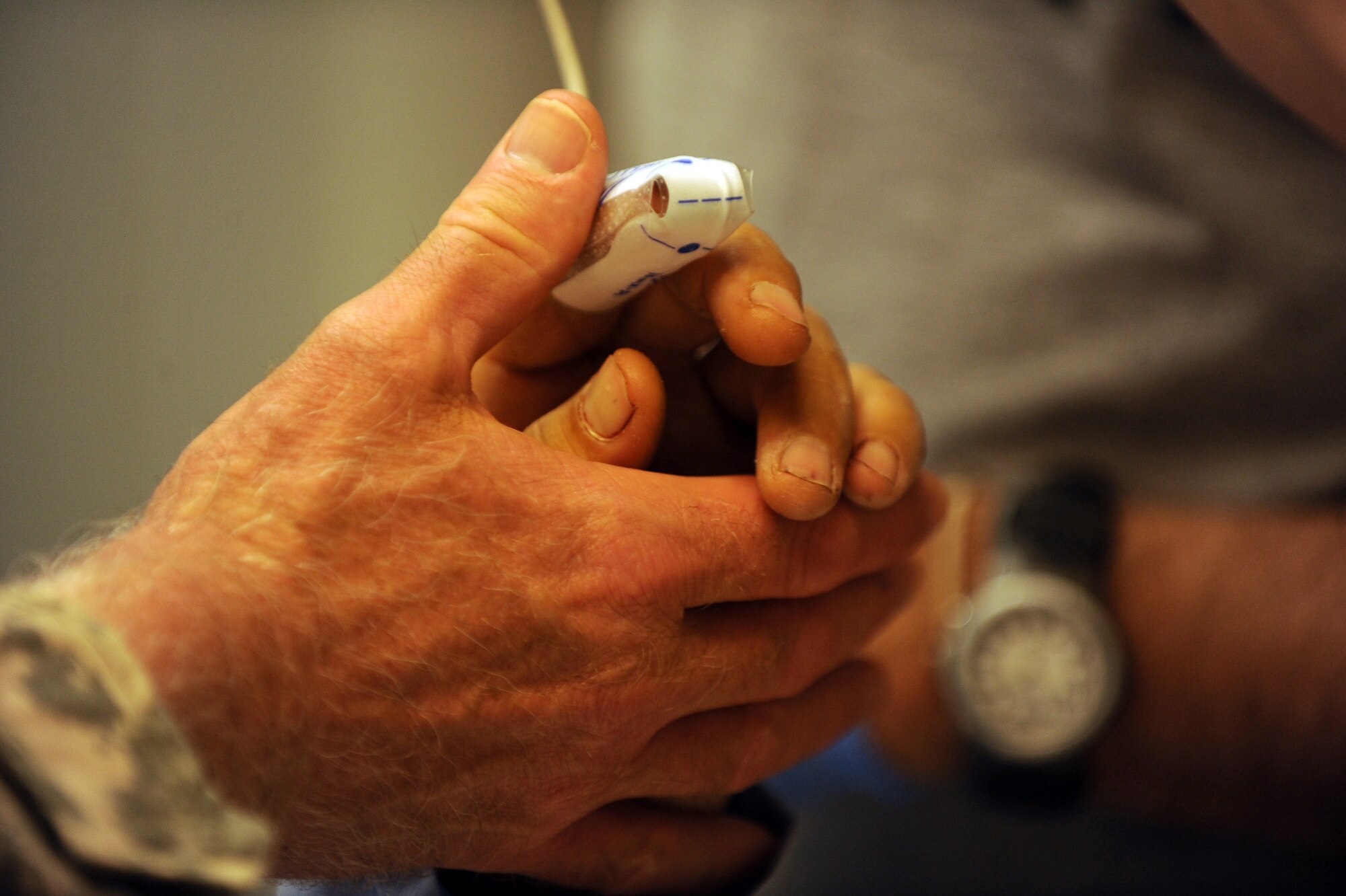 Army Lt. Col. (Dr.) Bob Kieffer, a vascular surgeon assigned to the 452nd Combat Support Hospital, checks the vitals of an Afghan man May 12, 2010, at Forward Operating Base Salerno, Afghanistan. (U.S. Air Force photo/Staff Sgt. Manuel J. Martinez/released) 
