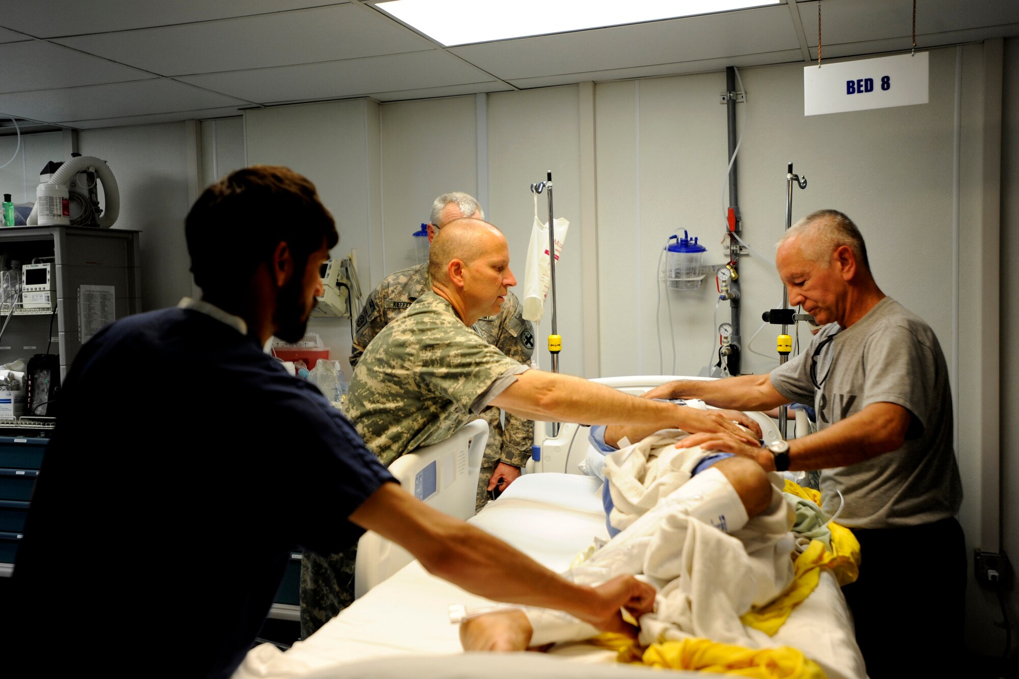 Army Capt. Andrew Kontowicz, left, a nurse assigned to the 452nd Combat Support Hospital, and Army Lt. Col. (Dr.) Davis Williams, an internal medicine doctor assigned to the 452nd CSH, with the help of an Afghan nurse conduct an assessment of a patient medically evacuated from the Craig Joint Theater Hospital at Bagram Airfield, May 12, 2010,  to Forward Operating Base Salerno, Afghanistan. With a mission of taking care of U.S. Coalition warfighters and their allies, the Salerno medical staff partners with medical entities within Afghanistan and responds to local national emergencies. (U.S. Air Force photo/Staff Sgt. Manuel J. Martinez/released) 
 