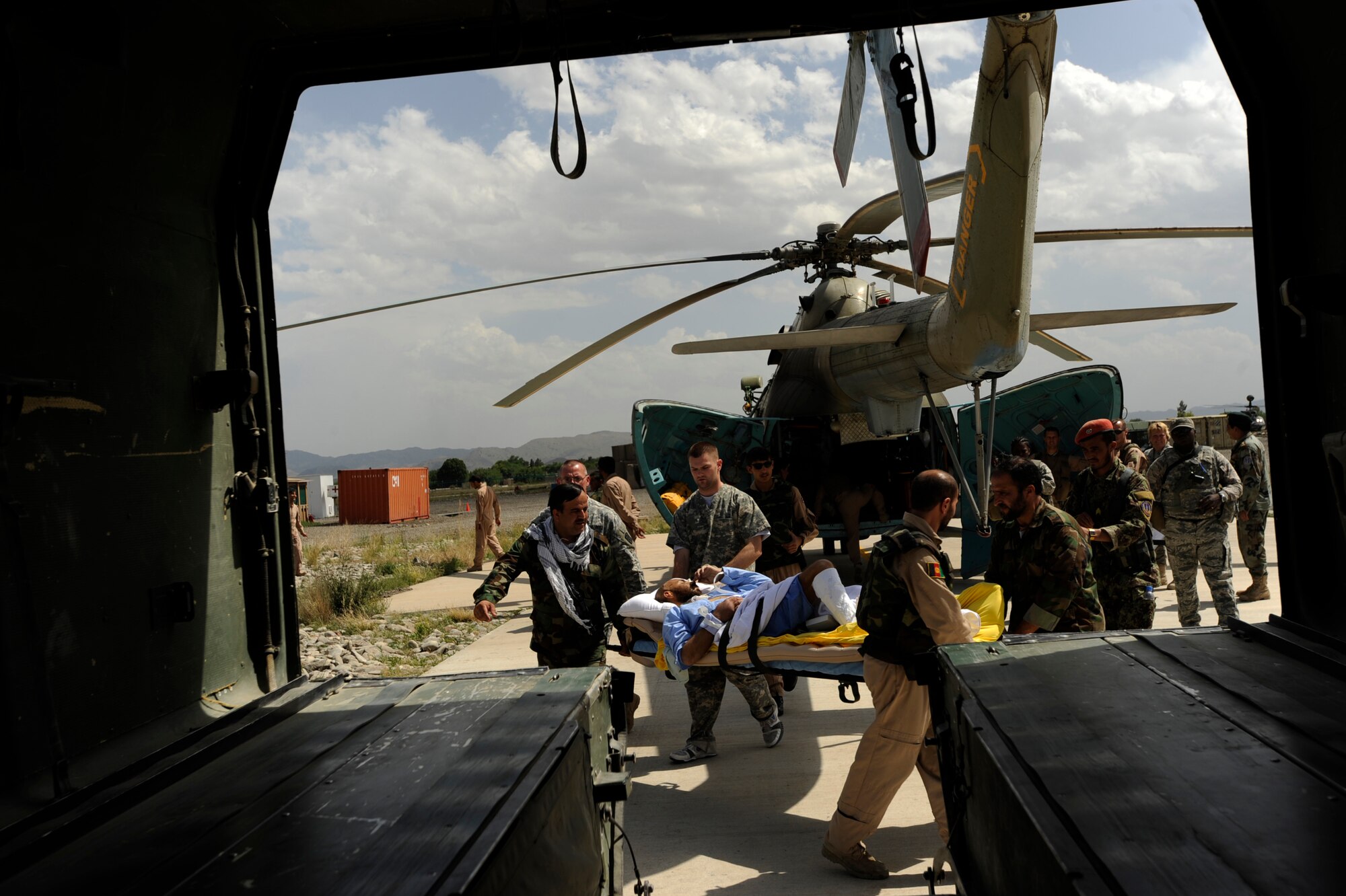 Afghan National Army Air Corps soldiers and flight medics carry a patient from an Mi-17 helicopter to an ambulance for transport to the Salerno Hospital, May 12, 2010, at Forward Operating Base Salerno, Afghanistan. (U.S. Air Force photo/Staff Sgt. Manuel J. Martinez/released) 
