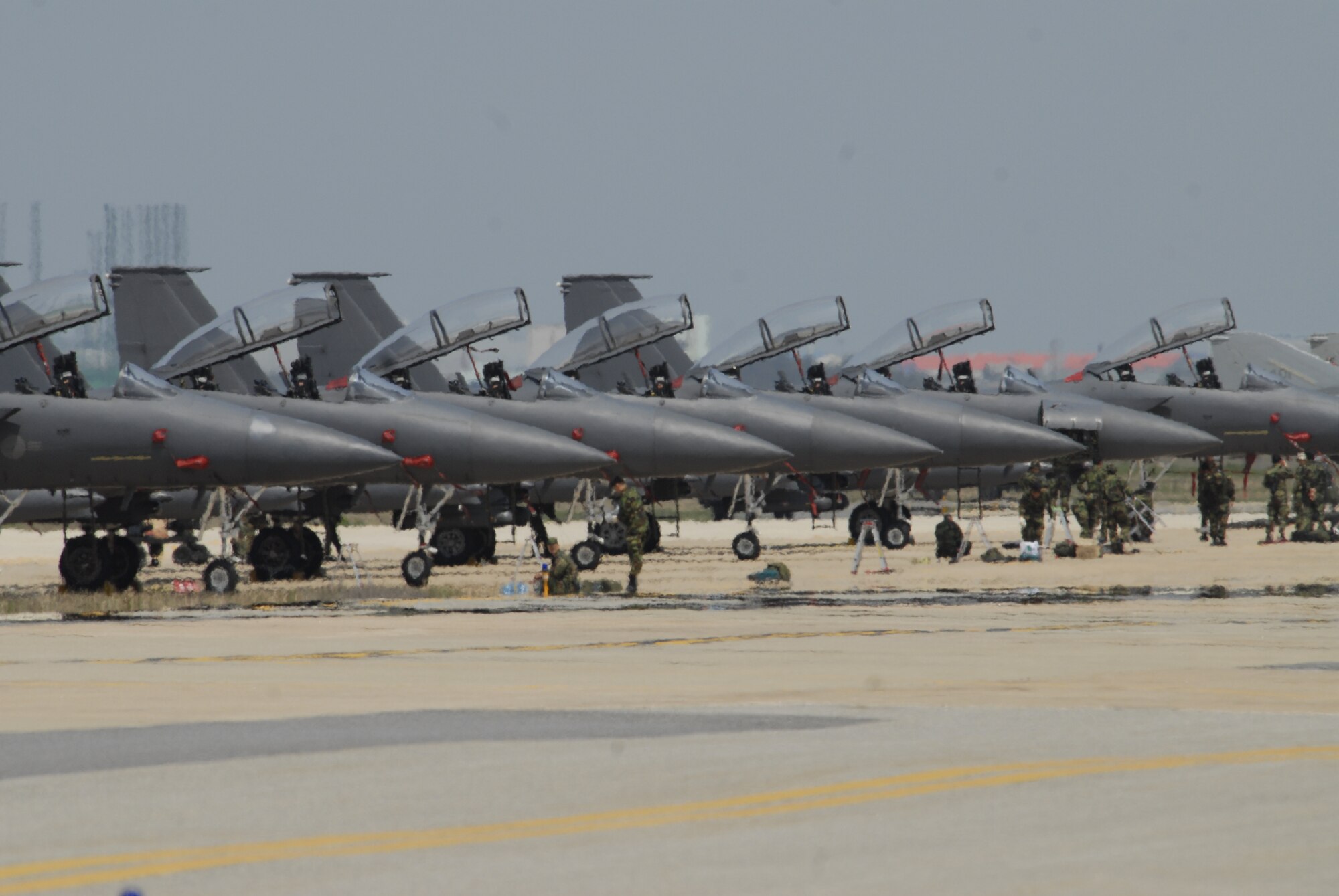 KUNSAN AIR BASE, Republic of Korea--8th Fighter Wing F-16 Fighting Falcons line-up on the runway during an exercise the week prior to the surge operations. The Wolf Pack tested its pilots, maintainers and supporting personnel with three weeks of flying operations. As a result the Wolf Pack met its goals of generating aircrafts in the required amount of time and is ready to fly, fight and win. (U.S. Air Force photo/Staff Sgt. Darnell Cannady)