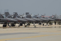 KUNSAN AIR BASE, Republic of Korea--8th Fighter Wing F-16 Fighting Falcons line-up on the runway during an exercise the week prior to the surge operations. The Wolf Pack tested its pilots, maintainers and supporting personnel with three weeks of flying operations. As a result the Wolf Pack met its goals of generating aircrafts in the required amount of time and is ready to fly, fight and win. (U.S. Air Force photo/Staff Sgt. Darnell Cannady)