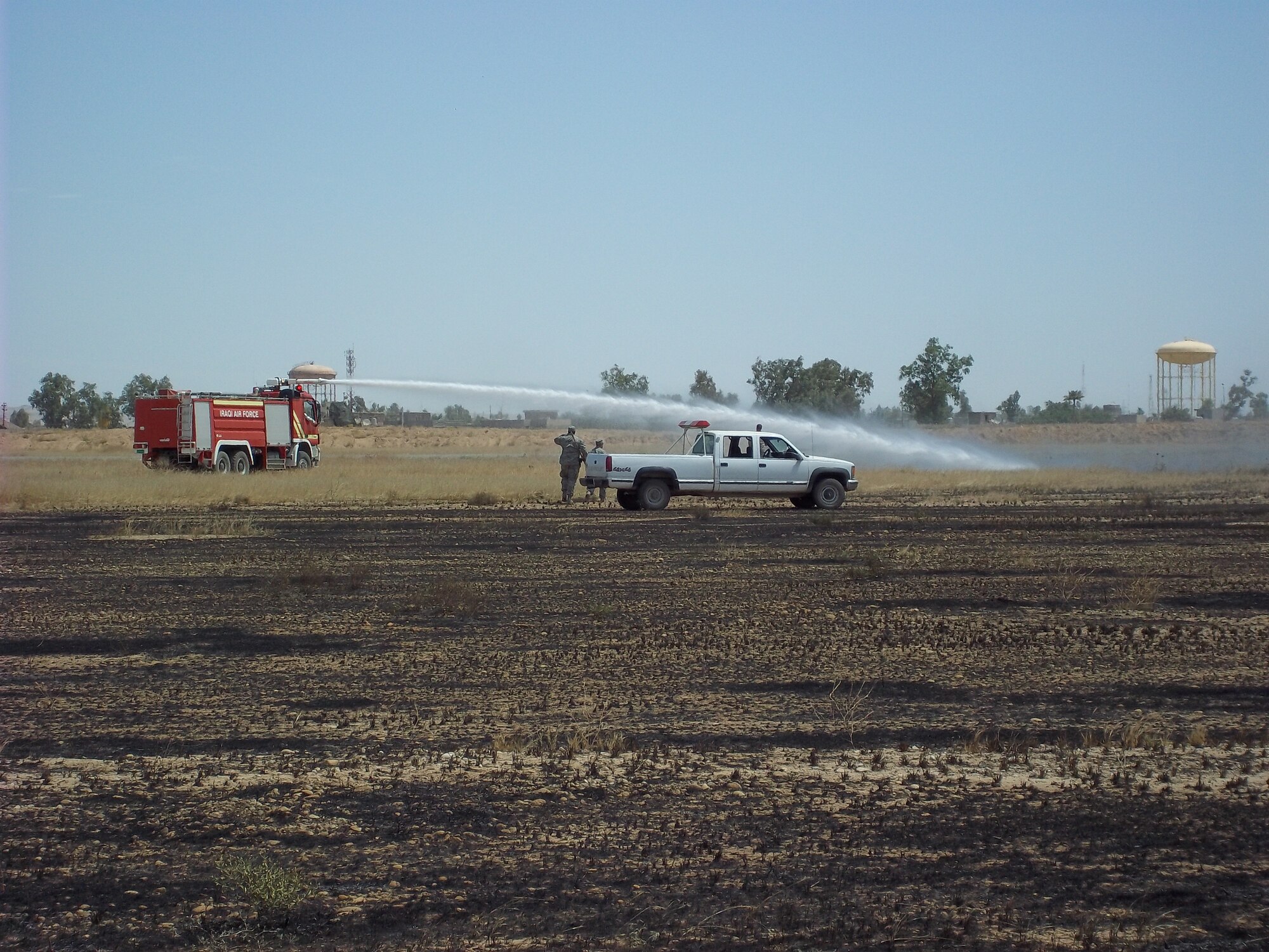 The 506th Expeditionary Civil Engineer Squadron firefighters and Iraqi Air Force firefighters reported to a fire at Kirkuk Regional Air Base, Iraq on May 20, 2010. 
A team of five Aircraft Rescue Firefighting vehicles, including two Iraqi ARFF vehicles, one fire engine, one mini-pumper and 31 firefighters, including six Iraqi firefighters responded. (U.S. Air Force courtesy photo)
