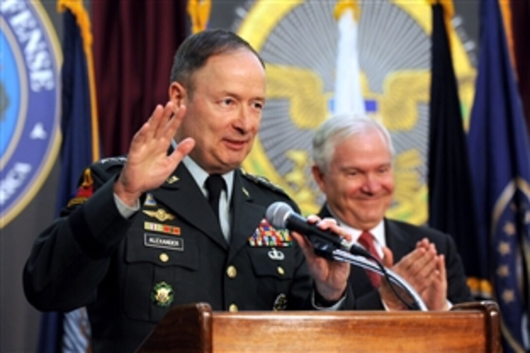 Commander of U.S. Cyber Command Army Gen. Keith Alexander receives applause from Defense Secretary Robert M. Gates and others during the activation ceremony of the command on Fort Meade, Md., May 21, 2010.  

