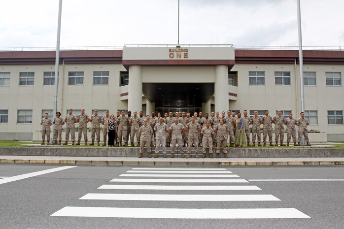 Station Istallation Personnel Administration Center personnel pose for a group picture in front of Building 1 here Monday. The station IPAC team passed the Marine Corps Administrative Analysis Team inspection conducted here May 17 and 18 with a near perfect score of 99.31.