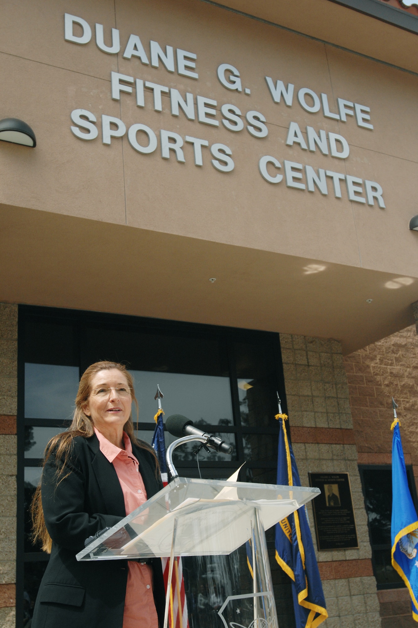 VANDENBERG AIR FORCE BASE, Calif. – Cindi Wolfe, wife of Navy Cmdr. Duane Wolfe, shares stories and memories of her late husband, during the fitness center dedication ceremony here Tuesday, May 25, 2010. Commander Wolfe was the deputy commander of the 30thMission Support Group and lost his life during an improvised explosive device attack  while serving in Iraq. (U.S. Air Force photo/Senior Airman Christopher Hubenthal)