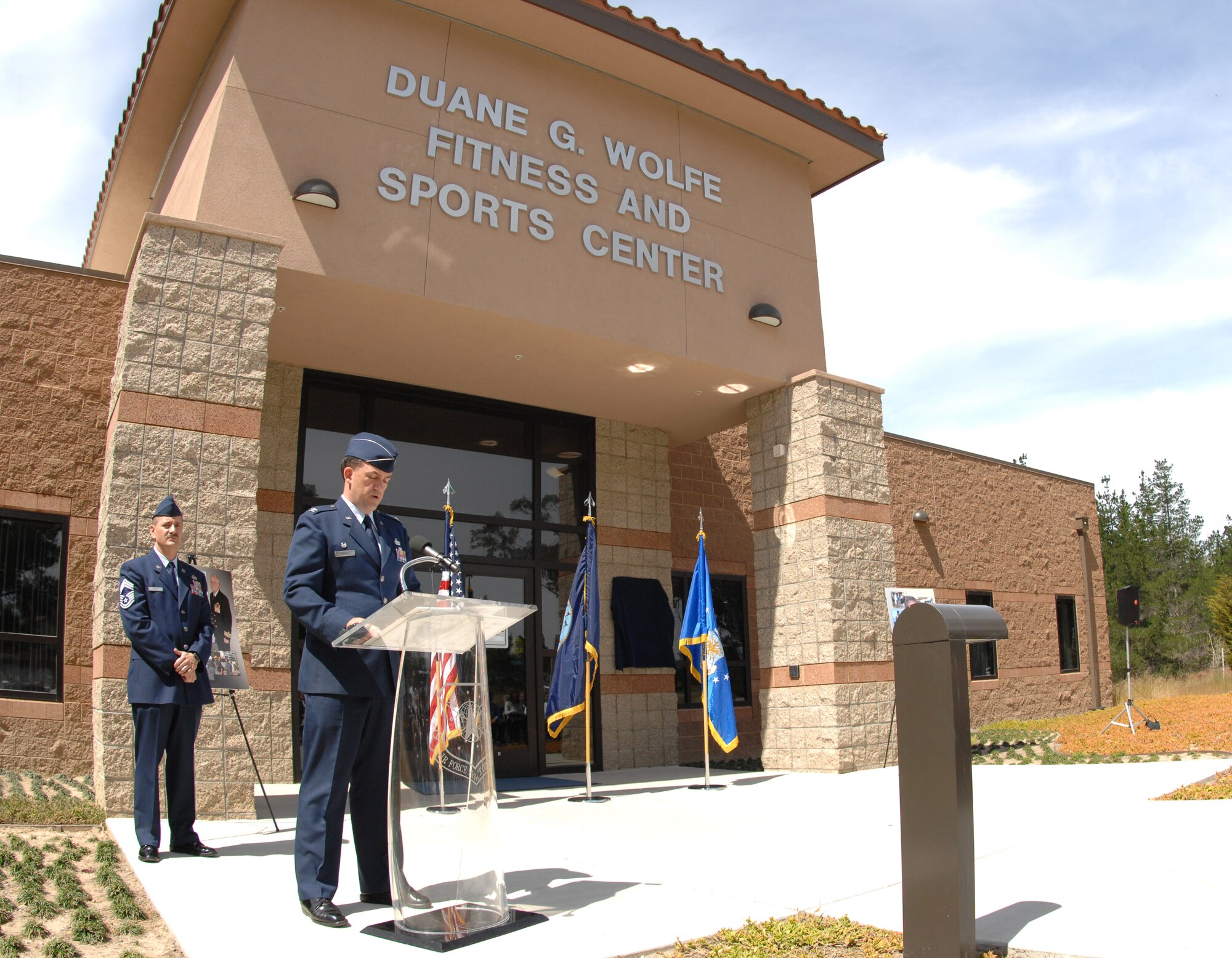 VANDENBERG AIR FORCE BASE, Calif. – Col. Richard Wright, the 30th Mission Support Group commander, offers words of remembrance for Navy Cmdr. Duane Wolfe during the fitness center dedication ceremony here Tuesday, May 25, 2010. In attendance were Commander Wolfe’s family, friends and members of Team V. (U.S. Air Force photo/Senior Airman Christopher Hubenthal)