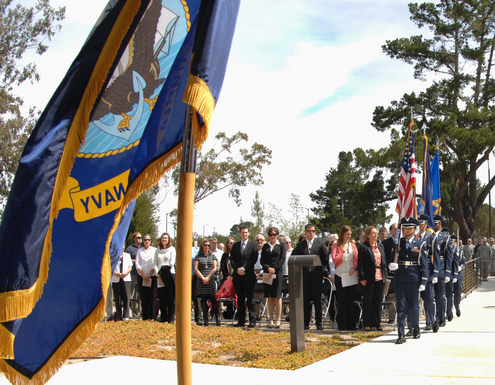 VANDENBERG AIR FORCE BASE, Calif. – Members of the Vandenberg Honor Guard present the colors during the fitness center dedication ceremony here Tuesday, May 25, 2010. The fitness center was renamed in honor of Navy Cmdr. Duane Wolfe, who lost his life during an improvised explosive device attack while serving in Iraq. (U.S. Air Force photo/Senior Airman Christopher Hubenthal)