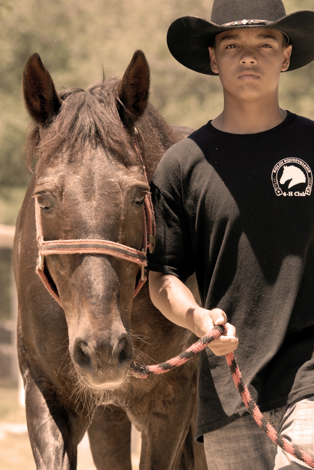 A cowboy takes his horse to the corral during the Eglin Sand and Spurs club open house May 22.  The club provided pony rides for kids and riding and training demonstrations.  Those who attended got an up close and hands-on experience with many of the different breeds of horses housed at the stables on base.  (U.S. Air Force photo/Samuel King Jr.)
