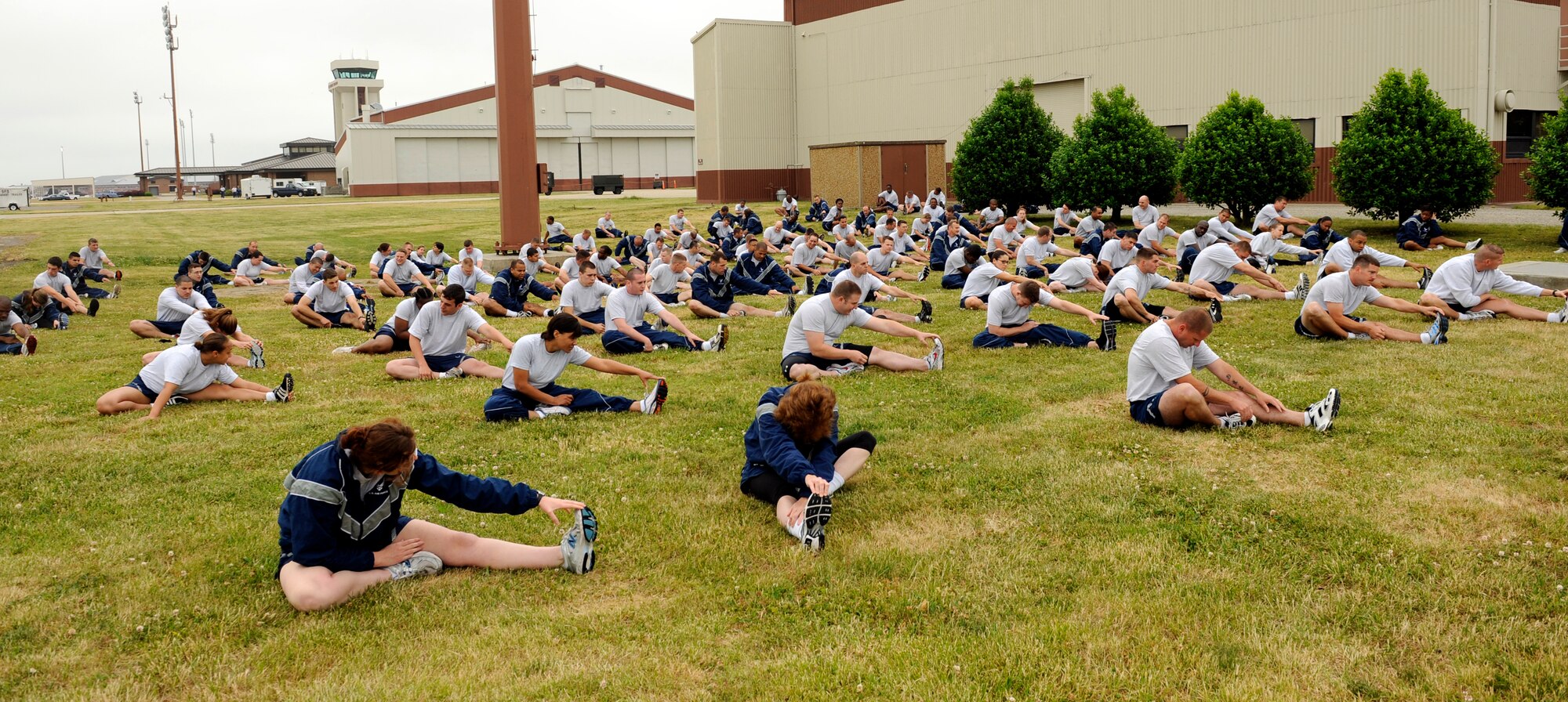 LANGLEY AIR FORCE BASE, Va. -- Airmen from the 1st Equipment Maintenance Squadron stretch before the Wingman Day fun run May 14. The 1.5-mile run on the flightline kicked off the day of events, filled with a variety of activities focusing on safety, alcohol and suicide awareness. (U.S. Air Force photo/Airman 1st Class Gul Crockett)