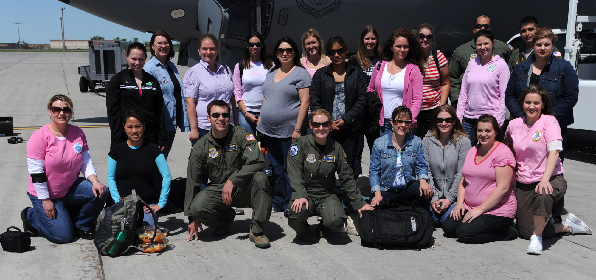 The crew and the spouses of the 905th Air Refueling Squadron pose in front of a KC-135 Stratotanker that was used to refuel the U.S. Air Force Thunderbirds during an incentive flight May 23. The Thunderbirds were on their way to Colorado Springs, Colo. after performing in an air show at Grand Forks Air Force Base, N.D.  (U.S. Air Force photo by Staff Sgt. Suellyn F. Nuckolls)