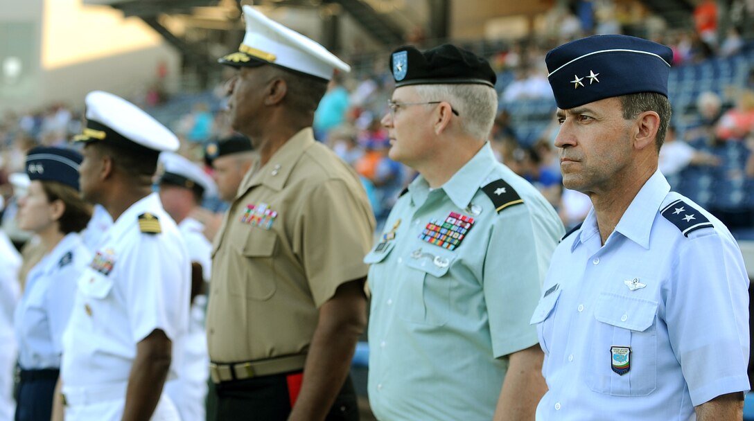 LANGLEY AIR FORCE BASE, Va. -- Maj. Gen. David Edgington, U.S. Joint Forces Command chief of staff, and other senior military representatives are recognized on the field during the opening ceremony of the Norfolk Tides baseball club’s 15th annual Military Appreciation Night May 22. The Tides hosts the event each year to honor service members from all branches of the military. (U.S. Air Force photo/Airman 1st Class Gul Crockett)