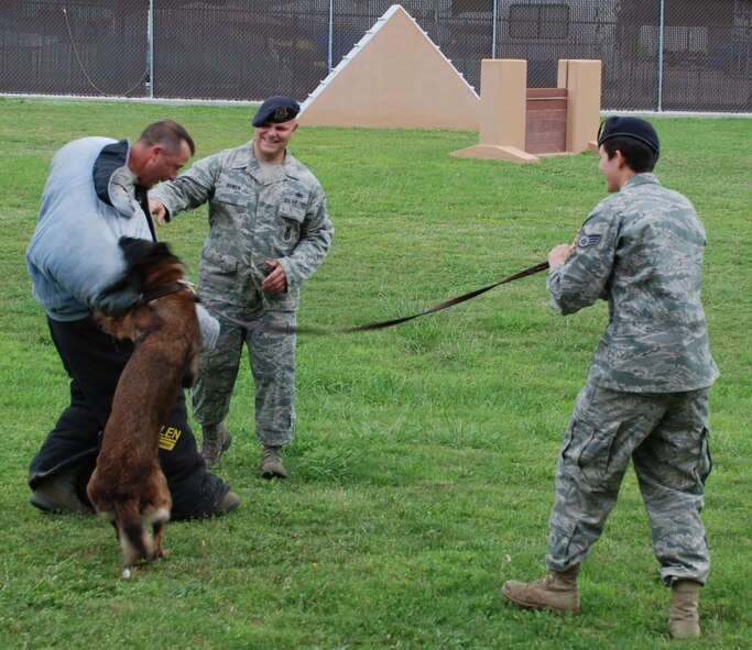 LAUGHLIN AIR FORCE BASE, Texas – Col. Andrew Cernicky, 47th Mission Support Group commander, participates in a military working dog demonstration with Xavier, one of Laughlin’s military working dogs, as Staff Sgt. Britney Simpson and Staff Sgt. Derrick Bowen, both of 47th Security Forces Squadron, make sure the demonstration doesn’t get out of hand. (U.S. Air Force photo by Airman 1st Class Blake Mize) 