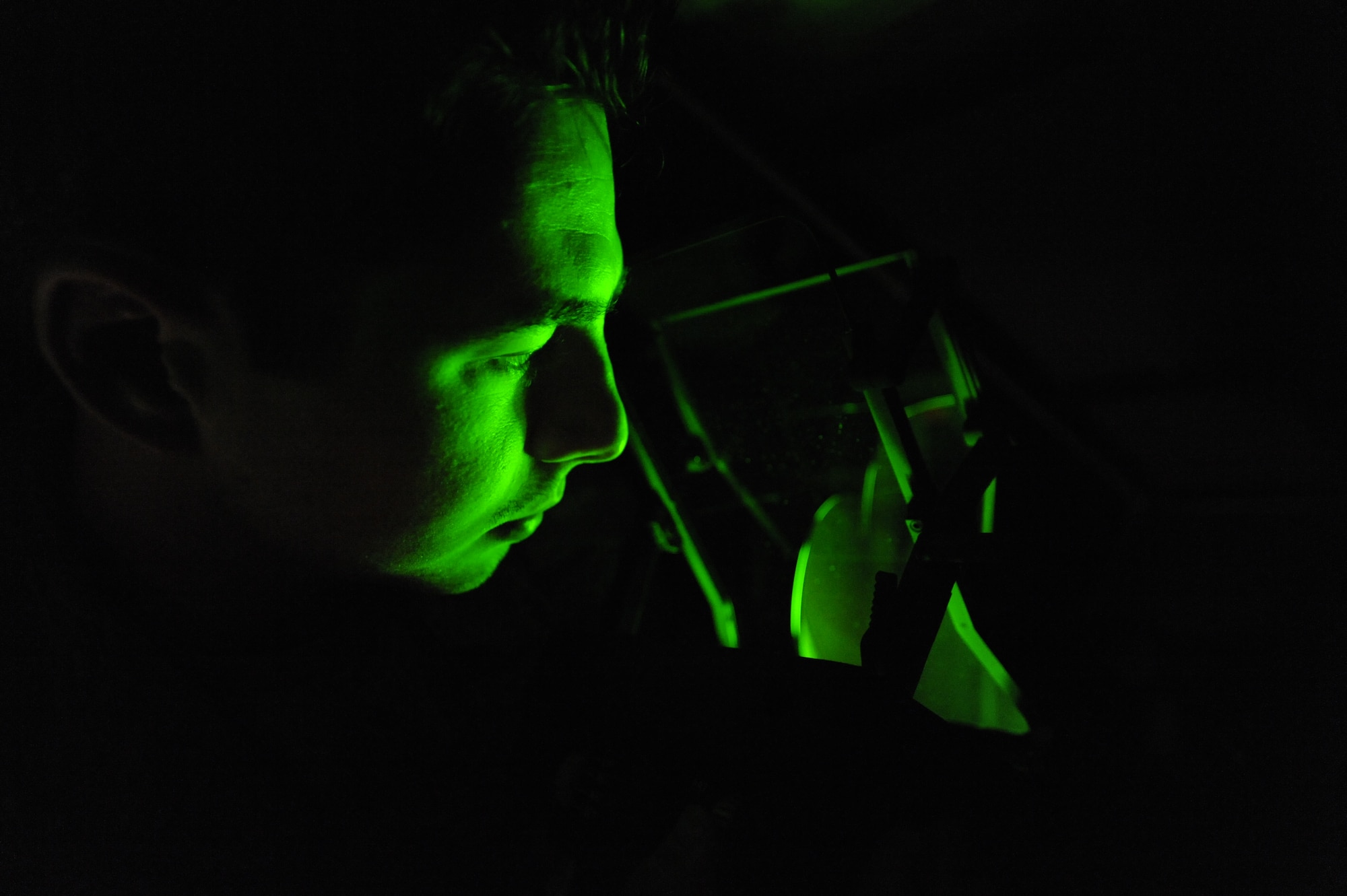 U.S. Air Force Senior Airman Keiron Legg checks the night mode on a C-17 Heads-Up-Display Unit May 25, 2010, at Joint Base Charleston, S.C. Airman Legg checks the night mode for sharpness, focus, uniformed brightness and to ensure that there is no double image with the HUD. The Avionics Shop recently won the Chief of Staff Team Excellence Award for 2009 from Air Force Reserve Command. Innovations designed by Charleston’s Avionics Shop in the repair process of Heads-Up Display Units were instrumental in winning this award and competing at the Air Force level. Airman Legg is a test station and components journeyman with the 437th Maintenance Squadron. (U.S. Air Force photo/James M. Bowman)
