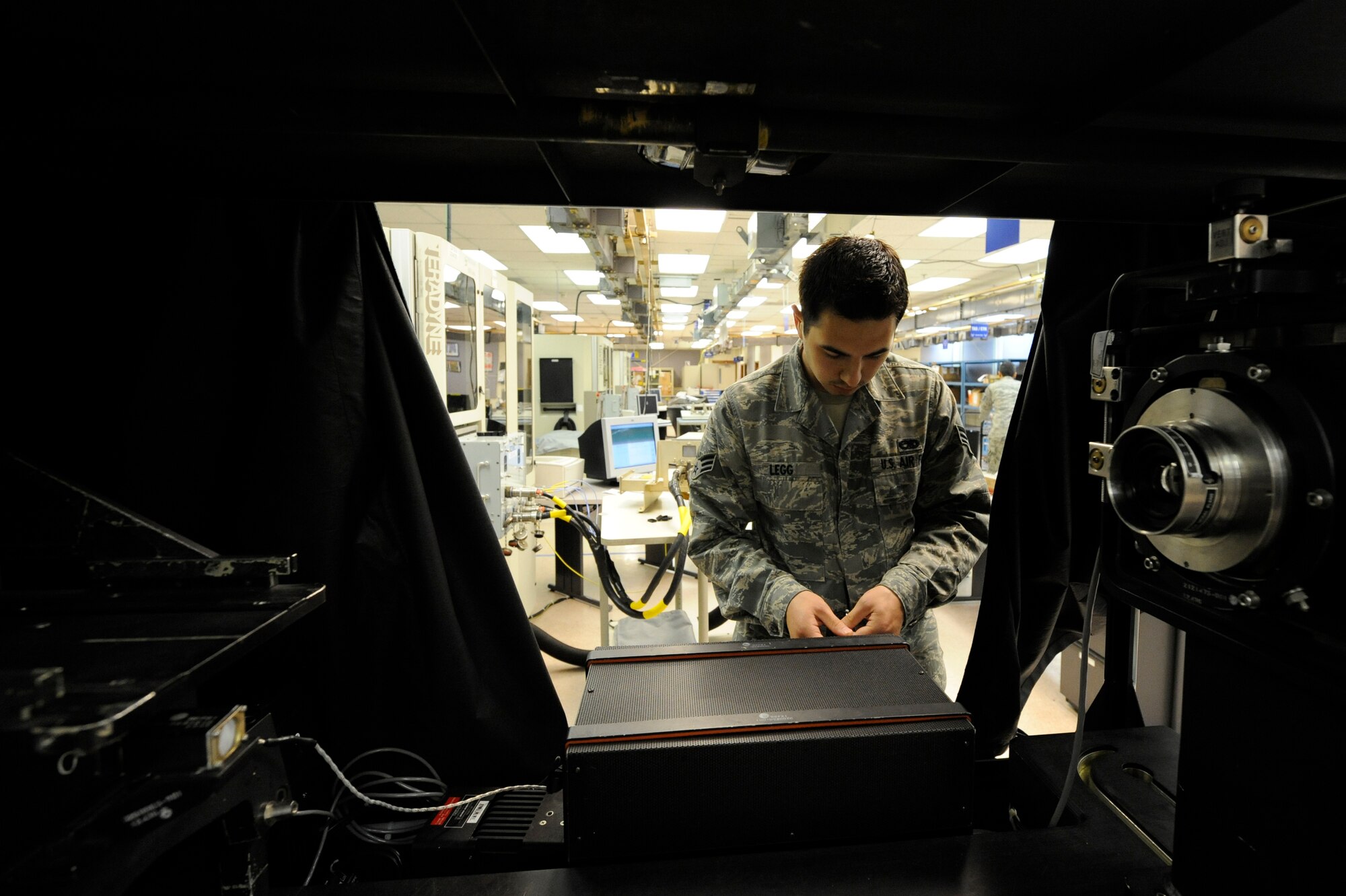 U.S. Air Force Senior Airman Keiron Legg sets up a Display Unit Test Set used to run an operations test on a C-17 Heads-Up Display Unit May 25, 2010, at Joint Base Charleston, S.C. The 437th Maintenance Squadron repairs more than 2,000 avionics units per year and this is accomplished by a total of only 23 personnel - 11 active duty, three air reserve technicians and nine civilians. Airman Legg is a test station and components journeyman with the 437th Maintenance Squadron. (U.S. Air Force photo/James M. Bowman)
