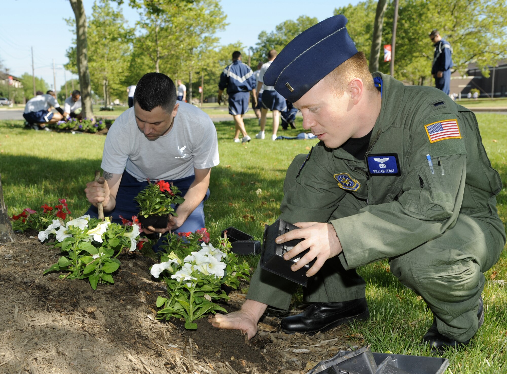 First Lt. William Cerat, 6th Airlift Squadron, C-17 Globemaster pilot, and Senior Airman C.J. Crew, 6th Airlift Squadron loadmaster, take part in Base Pride Day here May 20. (U.S. Air Force photo/Carlos Cintron)

