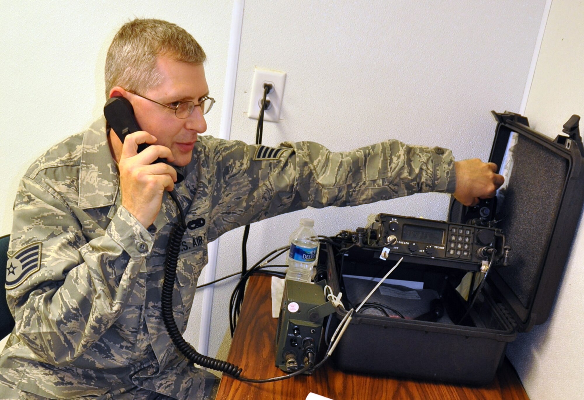 KILN, Miss. — U.S. Air Force Reserve Staff Sgt. Allen F. Mrock, a radio operator with the 910th Communications Flight (CF), conducts an operation check on a ultra-high frequency radio at Stennis International Airport here, May 19, 2010. Sergeant Mrock receives calls from C-130 aerial spray aircraft reporting oil dispersant released and other important mission updates. One of the 910th CF?s missions is to provide total communication support via radio and computer for aerial spray operations. Sergeant Mrock, a traditional Air Force Reservist and U.S. Postal Service employee in Pontiac, Mich., is among more than 50 YARS Reservists that have been deployed to the Gulf of Mexico since May 1, in support of the Deepwater Horizon oil spill cleanup efforts. U.S. Air Force photo by Maj. Brent J. Davis