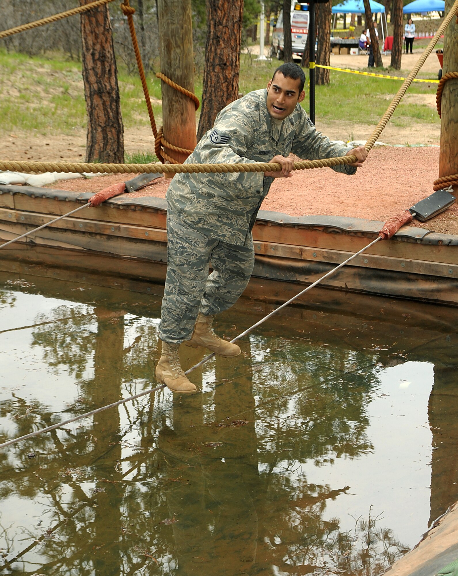 Staff Sgt. Mario Hernandez, 137th Space Warning Squadron, braves the obstacle course during the security forces competition at Guardian Challenge May 19. The 137th SWS and the 460th Space Wing joined forces for the competition. (U.S. Air Force photo by Duncan Wood)