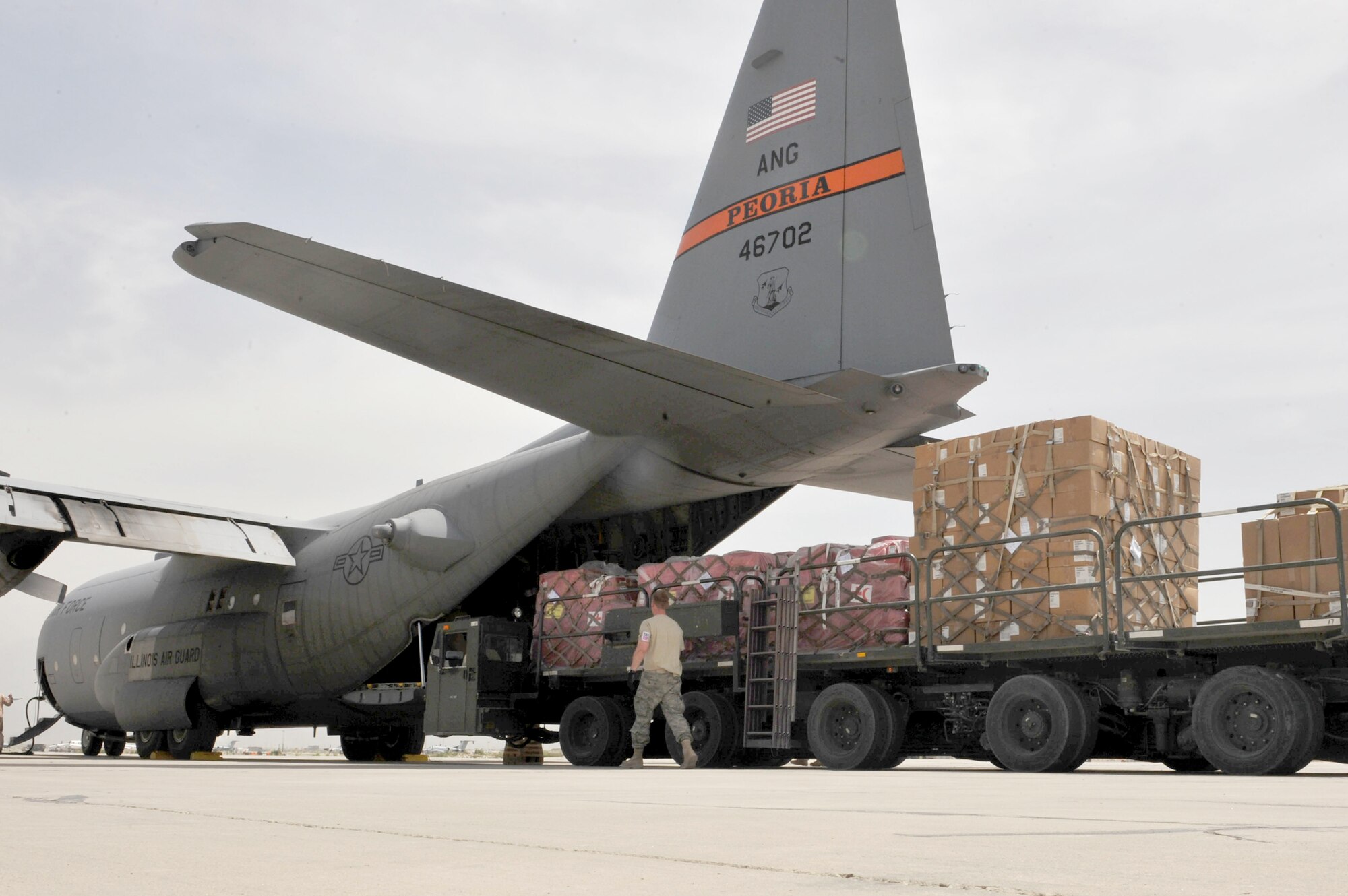 A C-130 Hercules is loaded with medical supplies, hygiene kits and water in support of flood relief efforts for the people of Tajikistan May 21, 2010, at Bagram Airfield, Afghanistan. (U.S. Air Force photo/Staff Sgt. Quinton Russ)