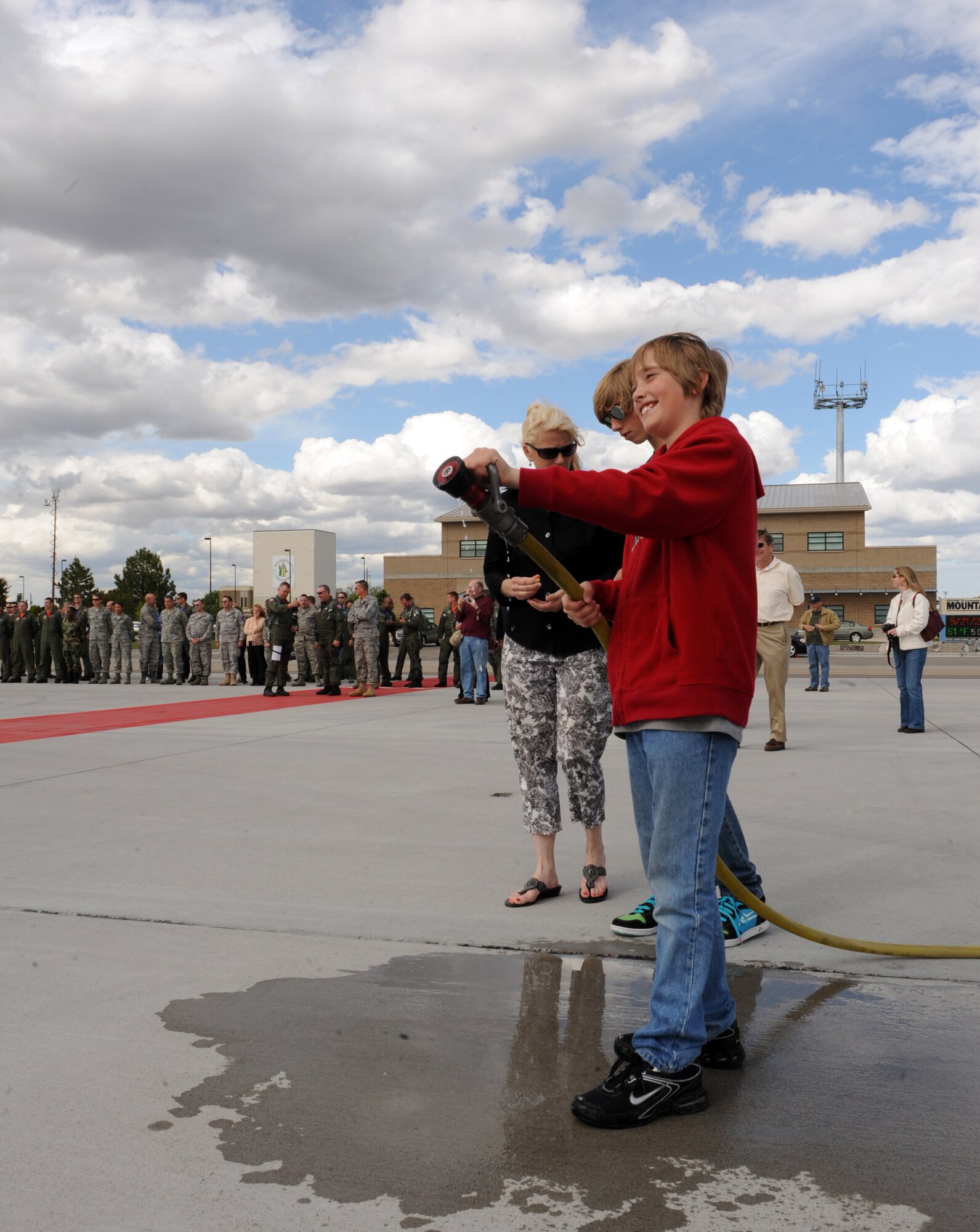 MOUNTAIN HOME AIR FORCE BASE, Idaho – Cole Bird, waits for his father, Col. John Bird, former 366th Fighter Wing commander, to climb out of an F-15E Strike Eagle after his final flight as commander, May 21. Colonel Bird has been selected to serve on the Joint Staff in Washington D.C. as the Chief of the Force Application Division at the Pentagon. (U.S. Air Force photo by Airman 1st Class Debbie Lockhart)