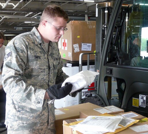 Senior Airman Douglas Smith Jr. inspects, accepts and processes cargo heading to South America and Haiti. Airman Smith is a cargo processing specialist with the 437th Aerial Port Squadron.
