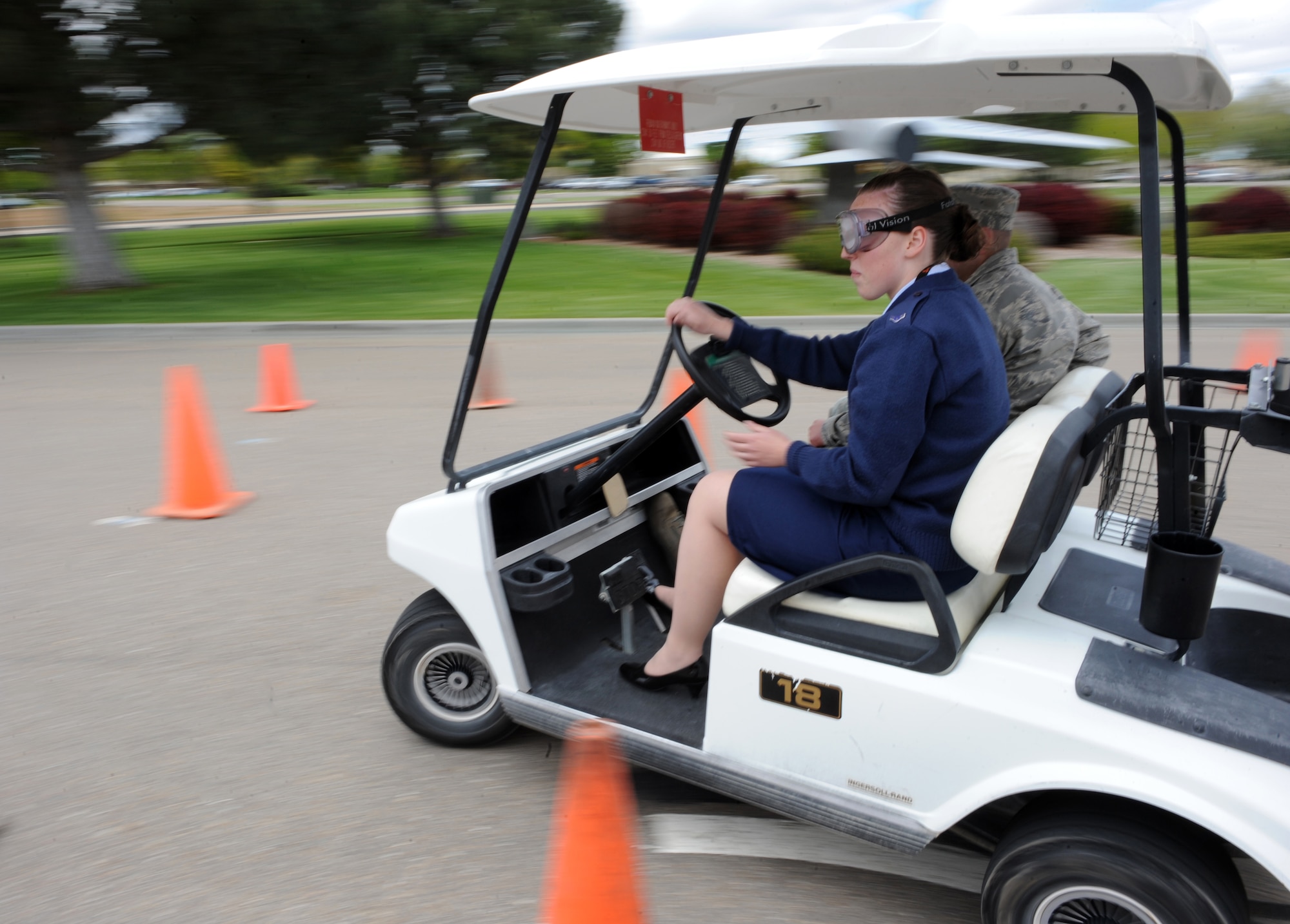 MOUNTAIN HOME AIR FORCE BASE, Idaho – Airman 1st Class Nikki Whited, 391st Fighter Squadron, drives a golf cart while wearing “beer goggles” during Wing Safety Day at Holt Park, May 24. The event included more than 20 local safety vendors, unit briefings and a safety brief at the base theater.  Activities at Holt Park included:  “Jaws of Life” vehicle extractions, child car seat checks, mock sobriety tests, golf cart driving with DUI goggles, Parks and Recreation/Fish and Game displays and many more. Wing Safety Day was intended to stress the importance of preventing mishaps while reviewing basic safety procedures to help decrease the risk of injury on and off duty. (U.S. Air Force photo by Airman 1st Class Debbie Lockhart)