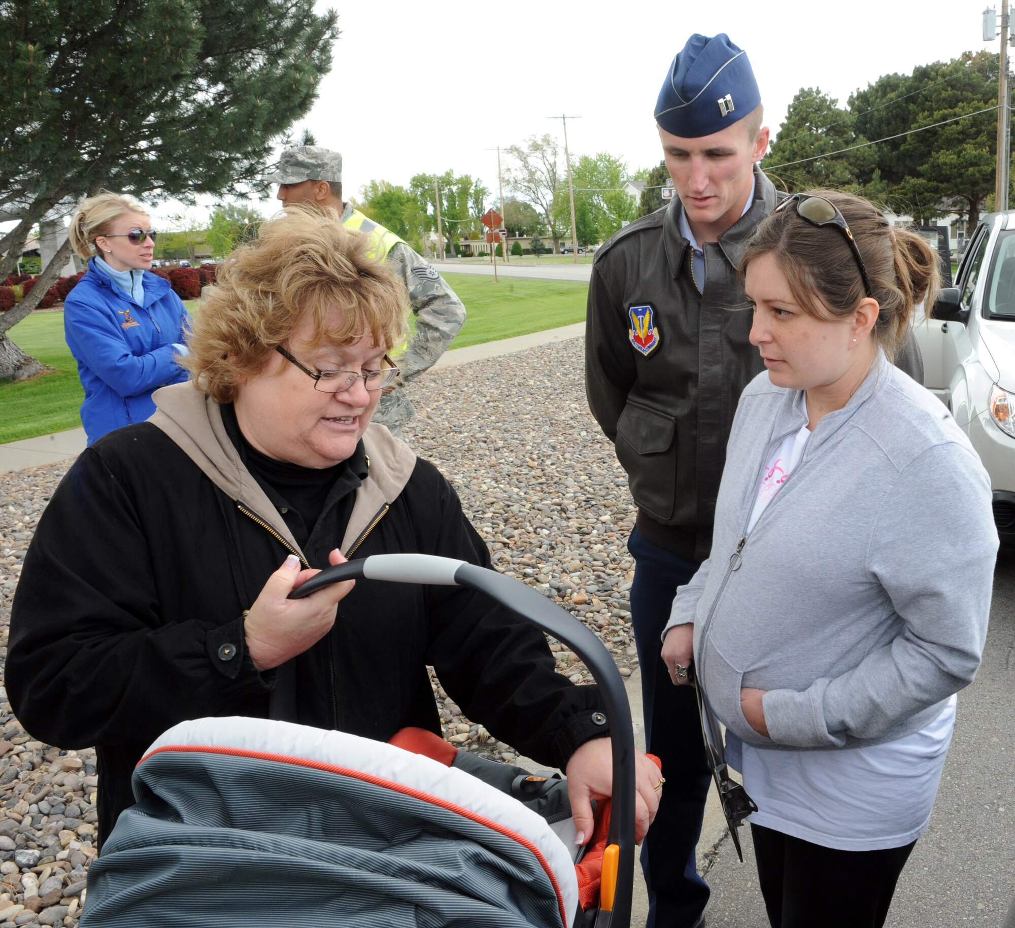 MOUNTAIN HOME AIR FORCE BASE, Idaho – Connie Powers, 366th Medical Group, performs a child seat check for Captain Ray Gunter and his wife Keren during Wing Safety Day at Holt Park, May 24. The event included more than 20 local safety vendors, unit briefings and a safety brief at the base theater.  Activities at Holt Park included:  “Jaws of Life” vehicle extractions, child car seat checks, mock sobriety tests, golf cart driving with DUI goggles, Parks and Recreation/Fish and Game displays and many more. Wing Safety Day was intended to stress the importance of preventing mishaps while reviewing basic safety procedures to help decrease the risk of injury on and off duty. (U.S. Air Force photo by Airman 1st Class Debbie Lockhart)