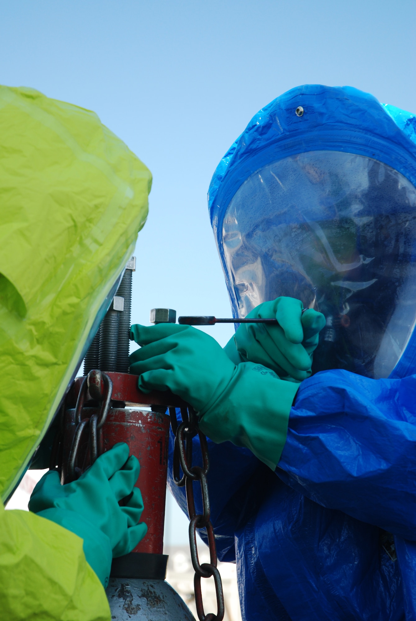 Airman 1st Class Walter Selkirk practices patching a 150-lbs chlorine cylinder at the Westover fire training area.  About 20 Fire fighters from around Massachusetts converged on Westover Air Reserve Base to participate in the Massachusetts Fire Fighter Academy's 160-hour Hazardous Materials Technician Course that was hosted here in May.