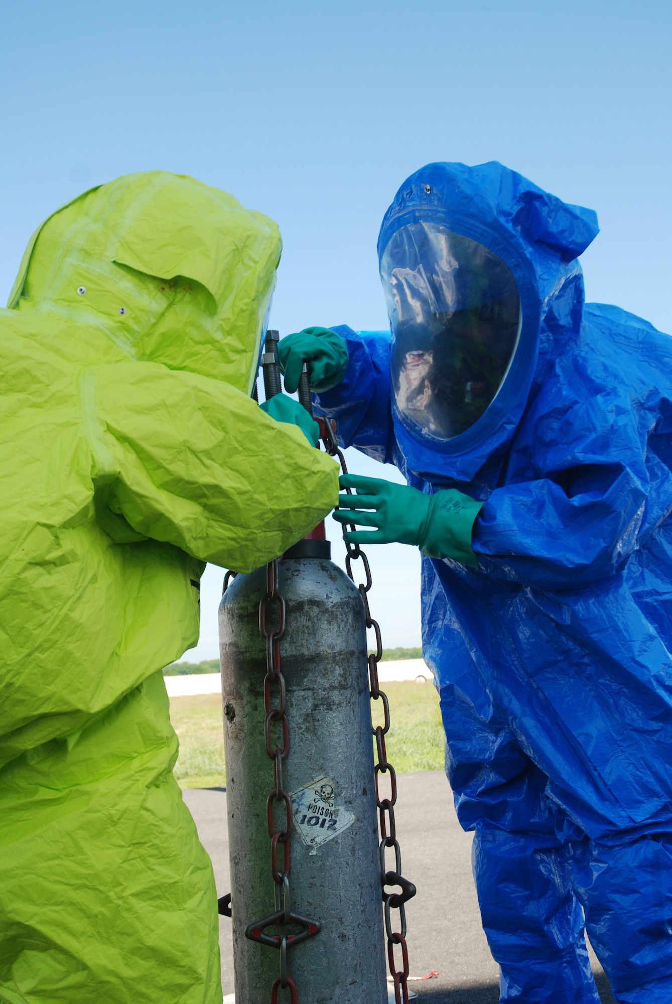 Fire fighters practice patching a 150-lbs chlorine cylinder at the Westover fire training area.  About 20 Fire fighters from around Massachusetts converged on Westover Air Reserve Base to participate in the Massachusetts Fire Fighter Academy's 160-hour Hazardous Materials Technician Course that was hosted here in May.
