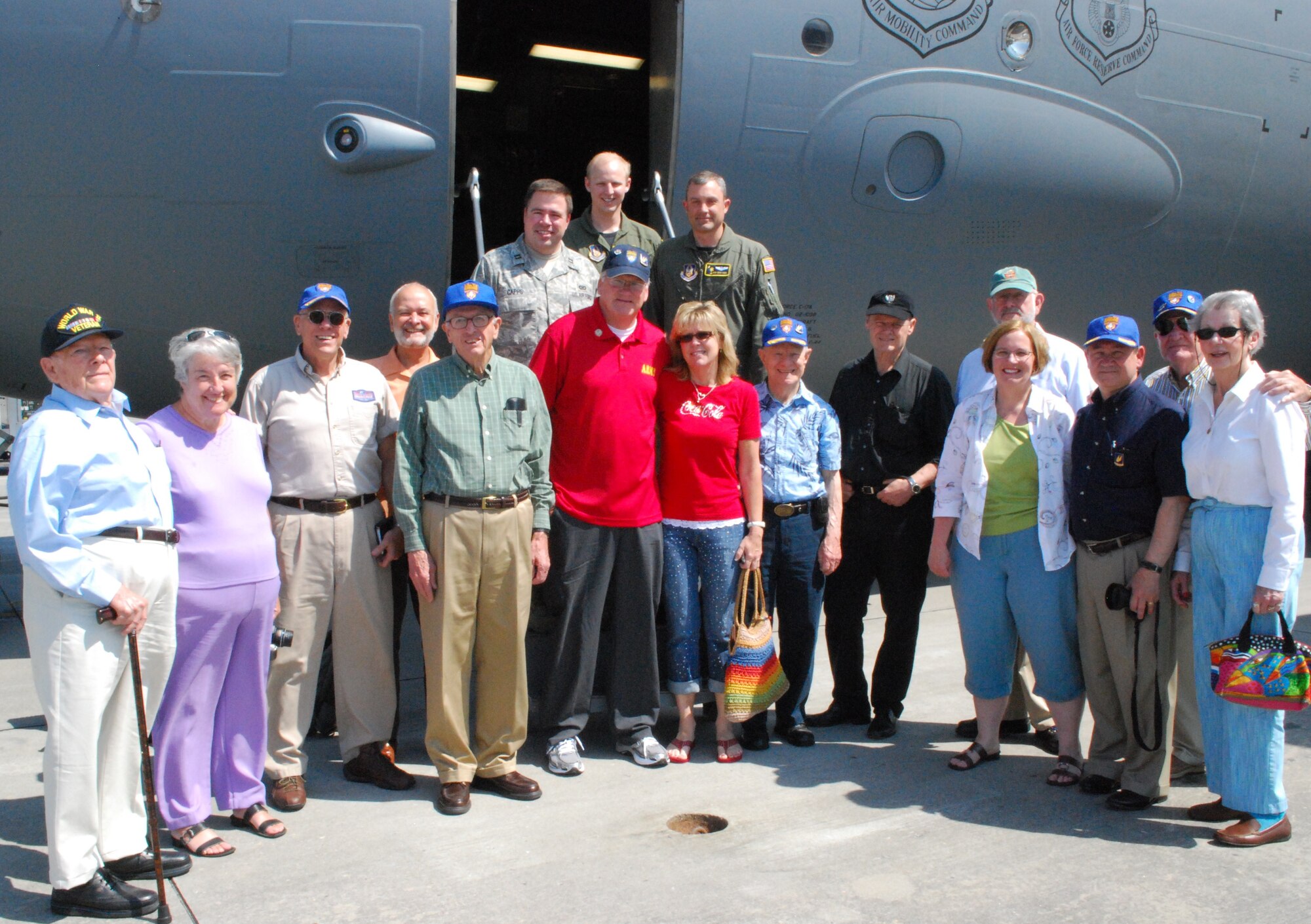 The 315th Airlift Wing hosted the 315th Troop Carrier Group Association reunion May 21 at Charleston Air Force Base, S.C. Members of the 315 TCG take a moment to pose for a photo next to a C-17 Globemaster III after receiving a tour of the aircraft and a briefing from crew with the 315 AW. (U.S. Air Force Photo/Staff Sgt. Darren S. Ellis)