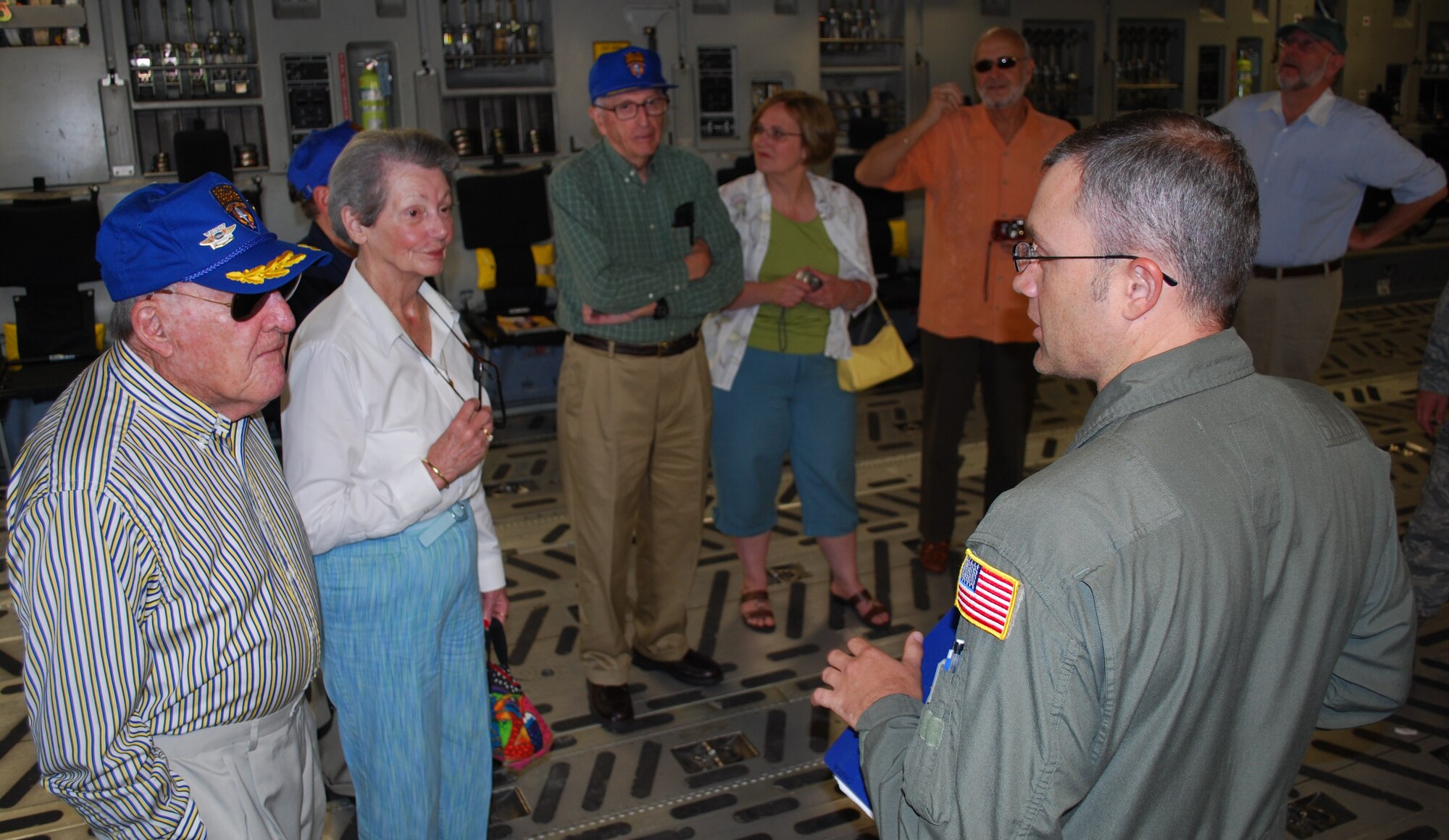 Members of the 315th Troop Carrier Group Association received a briefing aboard the C-17 Globmaster III by Master Sgt. Drew Cheek a loadmaster with the 315th Airlift Wing, Charleston Air Force Base, S.C. May 21 here. MSgt. Cheek and other reservist at Charleston can trace their roots back to the 315 TCG. (U.S. Air Force Photo/Staff Sgt. Darren S. Ellis)