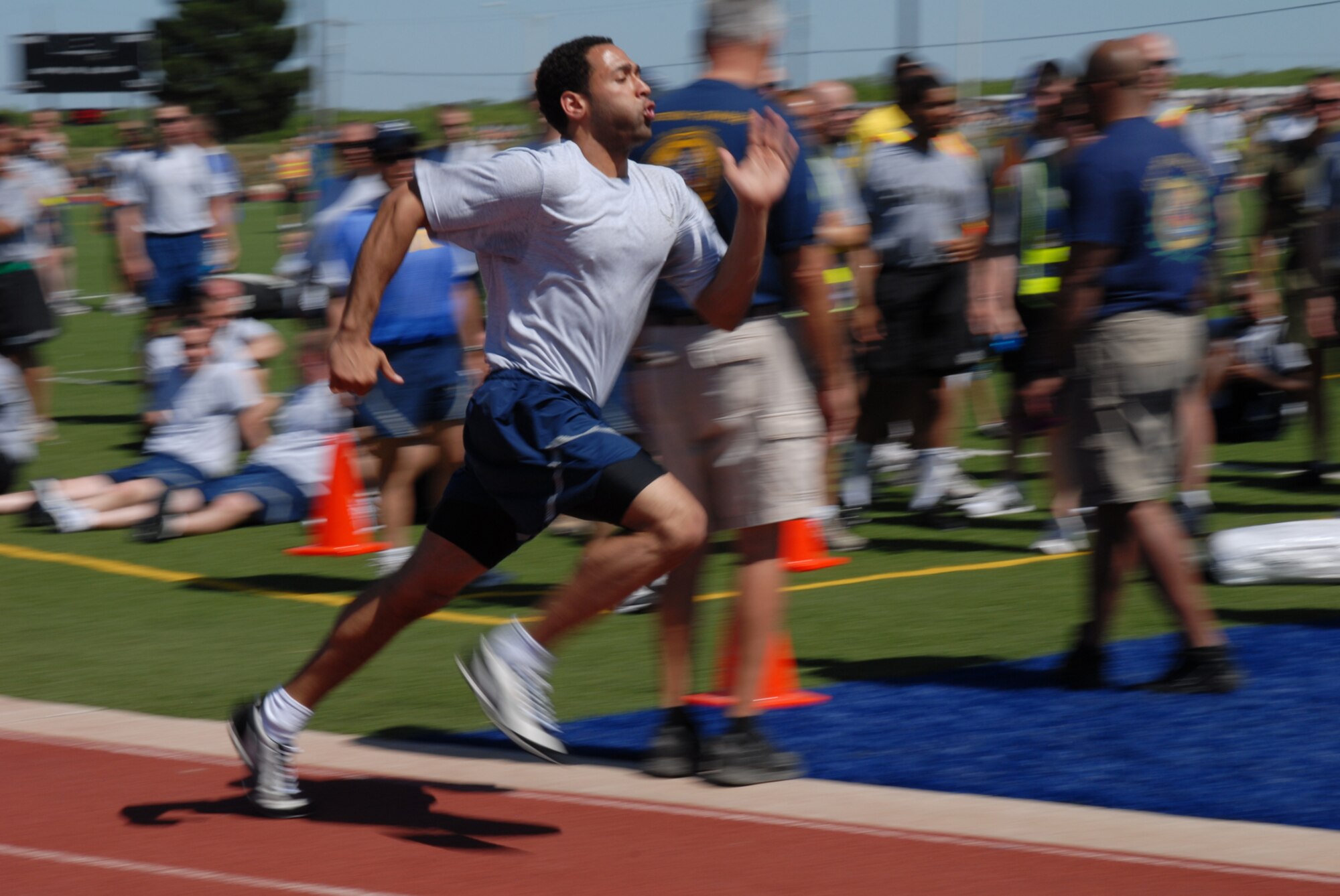 GOODFELLOW AIR FORCE BASE, Texas -- Tech. Sgt. Timothy Harris, 316th Training Squadron instructor, runs the first lap of the final race during sports day, May 21, 2010.  The finale was a four part event in which four representatives from the top four squadrons of the day competed. The first and fourth competitors ran a lap. The second performed push-ups and the third sit-ups. (U.S. Air Force photo/Staff Sgt. Laura R. McFarlane)
