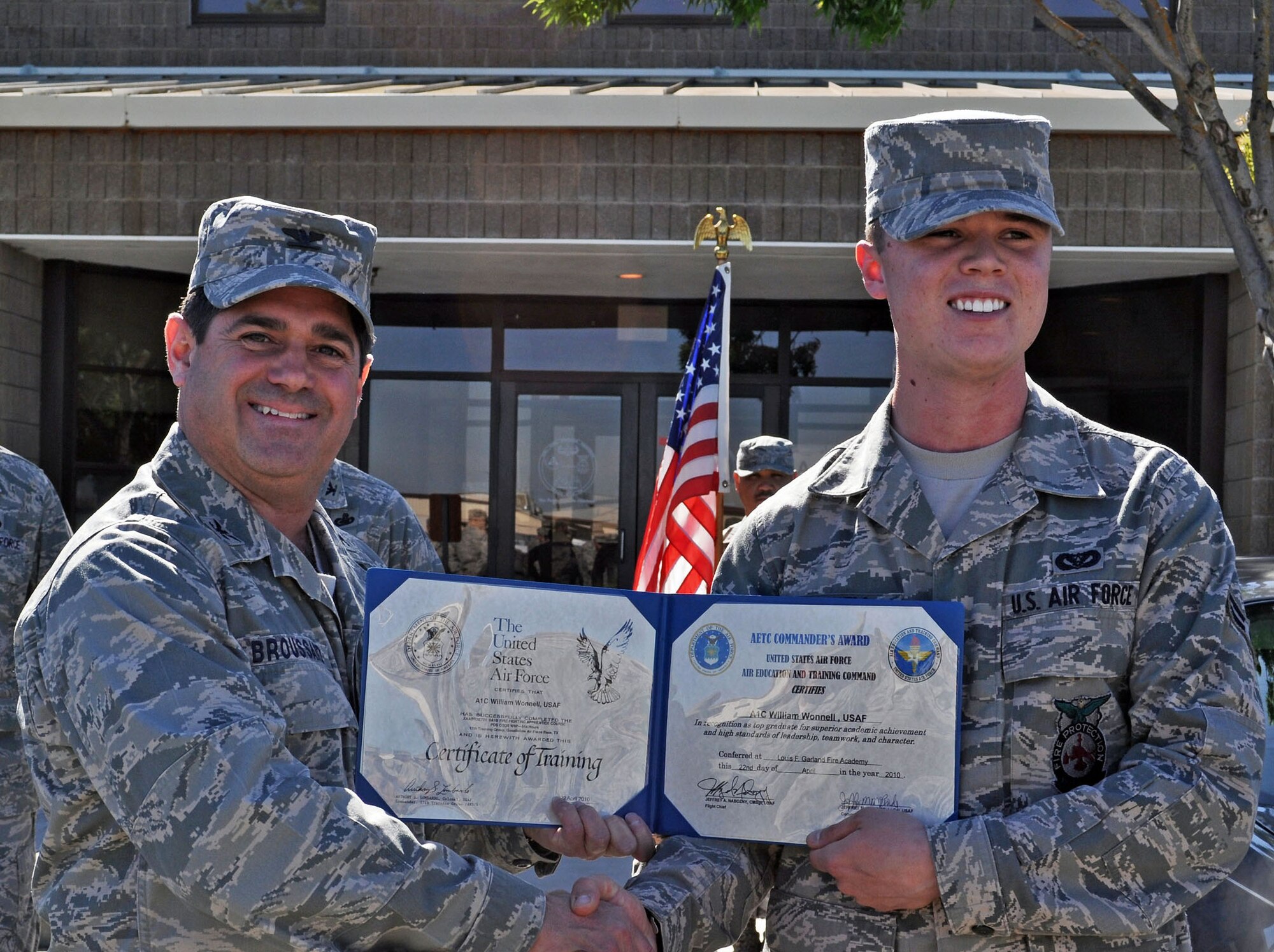 TRAVIS AIR FORCE BASE, Calif. -- Meet one of the newest Airmen joining the 349th Air Mobility Wing: Amn. William D. Wonnell received a surprise visit Sun., May 2, from Col. Barrett Broussard, vice wing commander, during the 349th Civil Engineer Squadron end of the duty day formation. Airman Wonnell, a fire fighter, just returned from his training at the Louis F. Garland Fire Academy, Goodfellow Air Force Base, Texas. Col. Broussard presented him three certificates. The first named him an honor graduate from AF Basic Military Training. The second was the Ace Award from the fire academy, for his 100% score on the Airport Firefighter certification test. The third certificate came from Air Education and Training Command, certifying him as "top graduate for superior academic achievement and high standards of leadership, teamwork and character." Col. Broussard also presented Amn. Wonnell with his personal Wing coin. Amn. Wonnell graduated basic in January, and the fire academy Apr. 22, 2010. (U.S. Air Force photo/Senior Master Sgt. Ellen L. Hatfield)