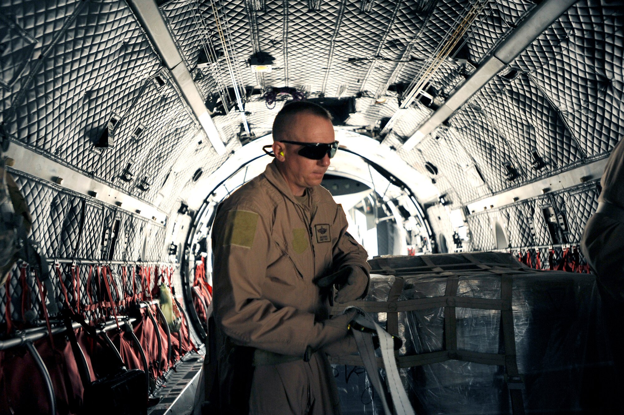 Senior Master Sgt. Mike Crews secures all loose cargo aboard a C-27 Spartan prior to takeoff May 15, 2010, at Kabul International Airport, Afghanistan. Sergeant Crews is a C-27 loadmaster adviser assigned to the 538th Air Expeditionary Advisory Squadron. (U.S. Air Force photo/Staff Sgt. Manuel J. Martinez) 
