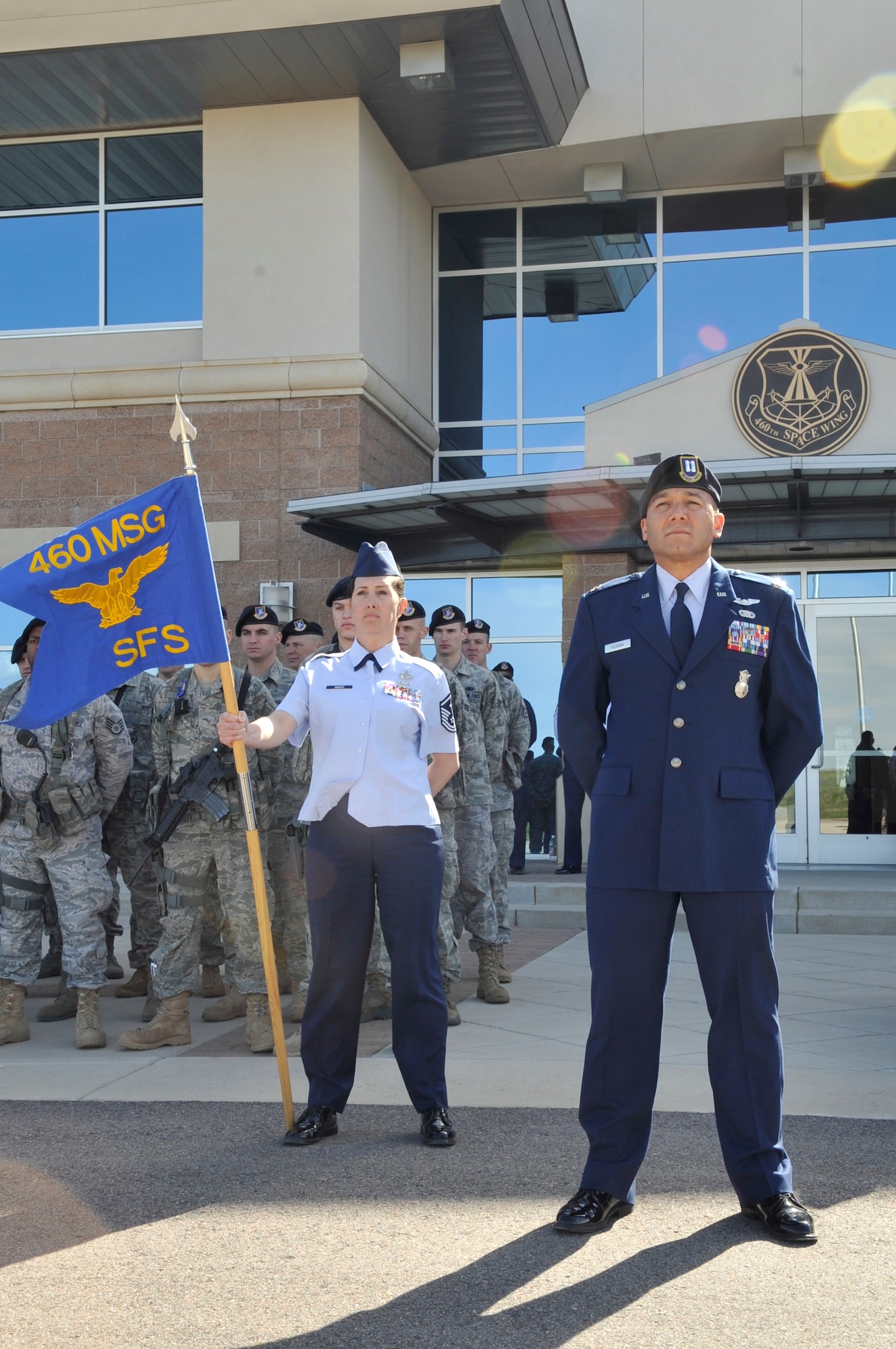BUCKLEY AIR FORCE BASE, Colo. -- Capt. William Fejeran and Master Sgt. Deanna Snider, 460th Security Forces Squadron, stand at parade rest during the National Police Week retreat ceremony May 10. (U.S. Air Force photo by Airman 1st Class Paul Labbe)