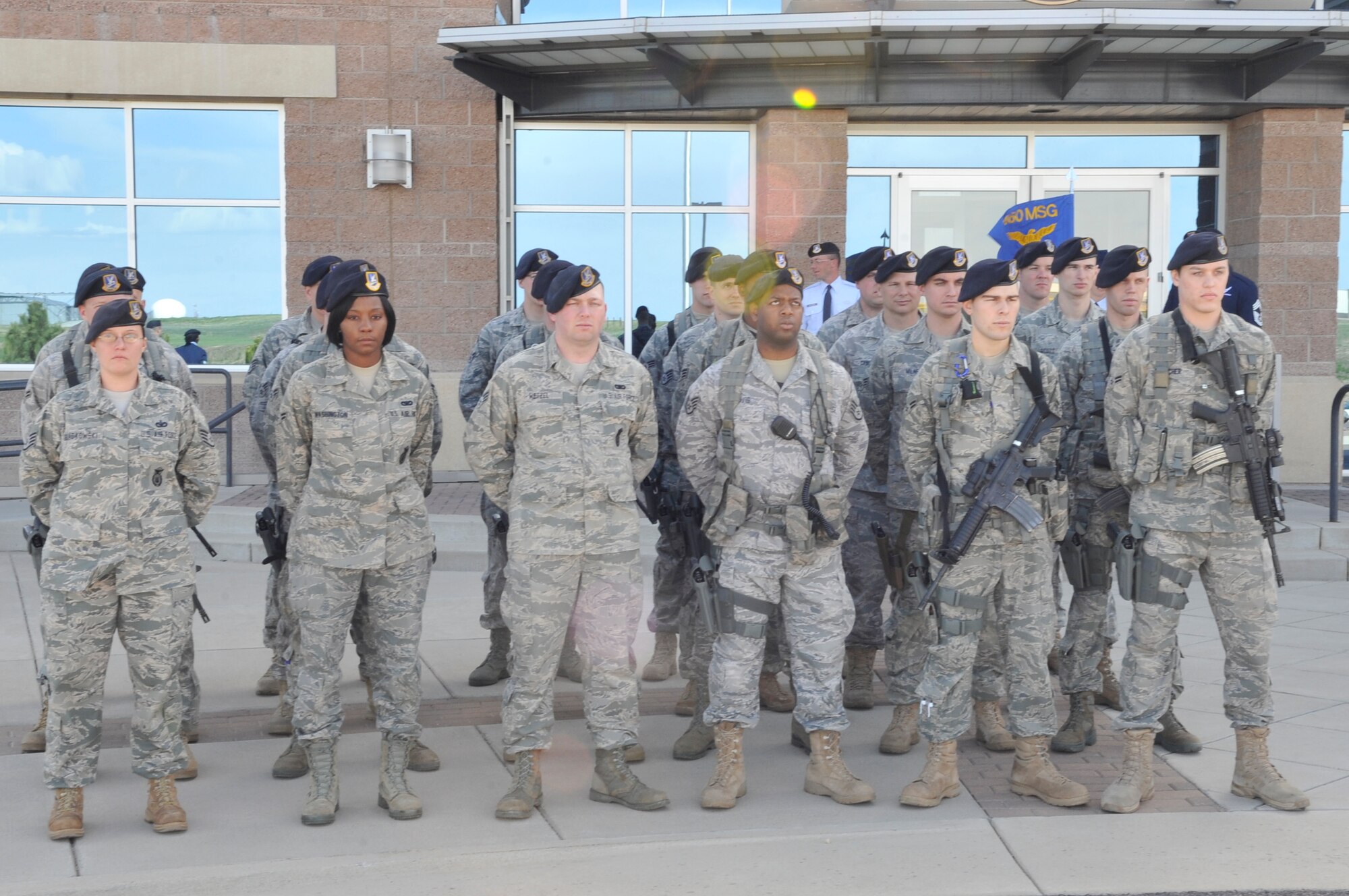 BUCKLEY AIR FORCE BASE, Colo. -- 460th Security Forces Squadron members stand at parade rest during the National Police Week retreat ceremony May 10. (U.S. Air Force photo by Airman 1st Class Paul Labbe)
