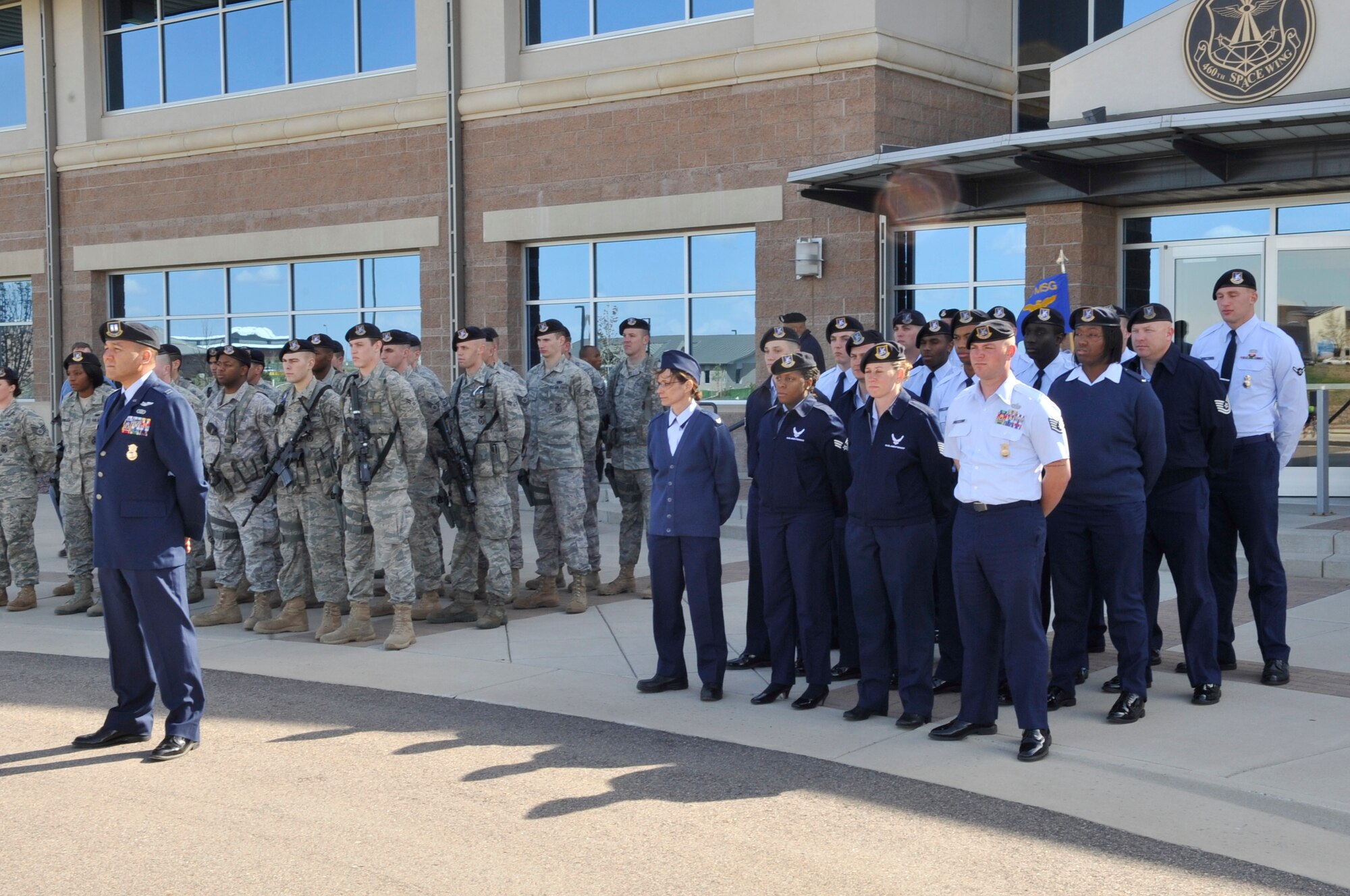 BUCKLEY AIR FORCE BASE, Colo. -- 460th Security Forces Squadron members stand at parade rest during the National Police Week retreat ceremony May 10. (U.S. Air Force photo by Airman 1st Class Paul Labbe)