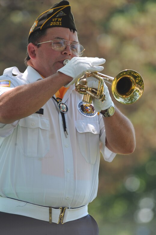 SEDALIA, Mo. - Mr. Daniel Aggeler, Veterans of Foreign Wars Post 2591 Honors Team bugler, plays taps at 2nd Lt. George Whiteman's memorial ceremony Saturday. The VFW Post 2591 Honors Team also retired the colors and performed a 21-gun salute at the ceremony. (U.S. Air Force photo/Airman 1st Class Carlin Leslie)
 