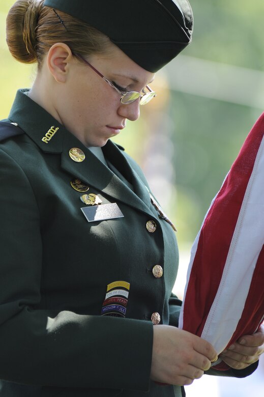 SEDALIA, Mo. - Cadet 2nd Lt. Mareena Pare, Smith Cotton High School Junior RTOC color guard commander, bows her head during the invocation before ordering to raise the colors at the 2nd Lt. George Whiteman Memorial ceremony Saturday. 2nd Lt. Whiteman was honored by many local dignitaries and his family members. (U.S. Air Force photo/Airman 1st Class Carlin Leslie)
