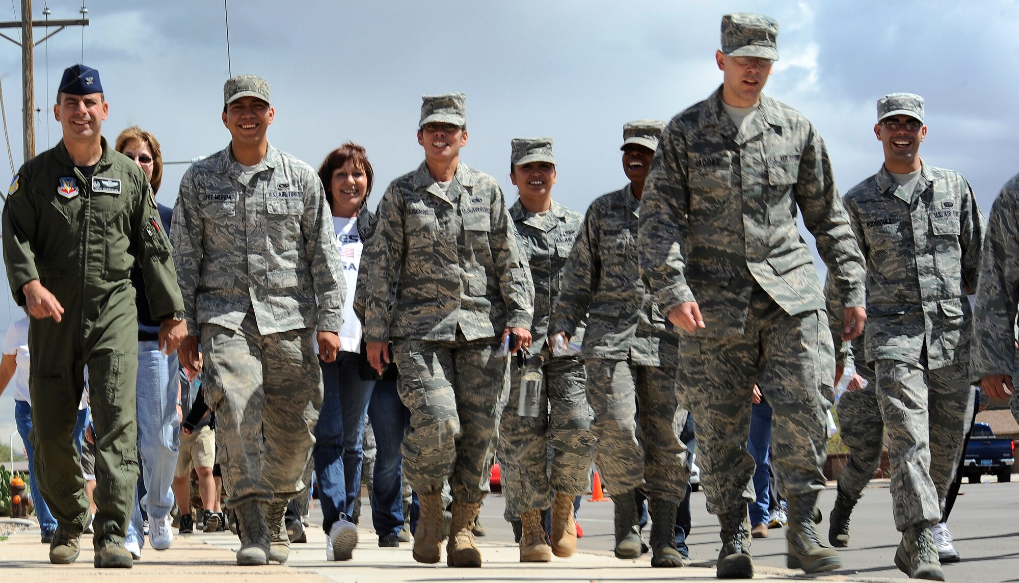 HOLLOMAN AIR FORCE BASE, N.M. -- Col. Jeff Harrigian, (far left) 49th Fighter Wing commander, walks with Airmen and their families during the Sexual Assault Awareness walk April 23, 2010. The Sexual Assault Prevention and Response office organized a walk to help members of Holloman show their support on preventing sexual assaults in the Air Force.  (U.S. Air Force photo by Airman 1st Class Veronica Stamps / Released)