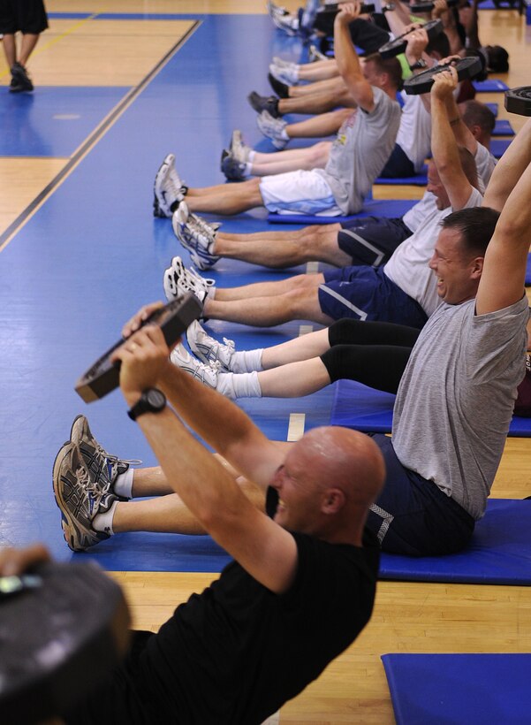 LANGLEY AIR FORCE BASE, Va. -- Prism Sports participants perform abdominal focused exercises May 18.  Prism Sports is a high intensity workout designed to develop an athlete’s power, movement biomechanics, and strength while also reducing the likelihood of non-contact injury by teaching correct exercise technique, increasing lean body mass, gaining strength and flexibility, correcting postural deviations, and developing the body’s metabolic energy system.  (U.S. Air Force Photo/Staff Sgt. Christina M. Styer)