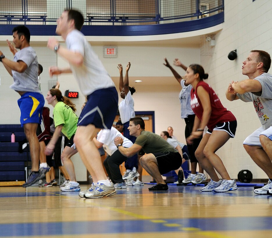LANGLEY AIR FORCE BASE, Va. -- Prism Sports participants perform squat jumps to half court and back focusing on lower body conditioning May 18.  Prism Sports is a high intensity workout designed to develop an athlete’s power, movement biomechanics, and strength while also reducing the likelihood of non-contact injury by teaching correct exercise technique, increasing lean body mass, gaining strength and flexibility, correcting postural deviations, and developing the body’s metabolic energy system.  (U.S. Air Force Photo/Staff Sgt. Christina M. Styer)