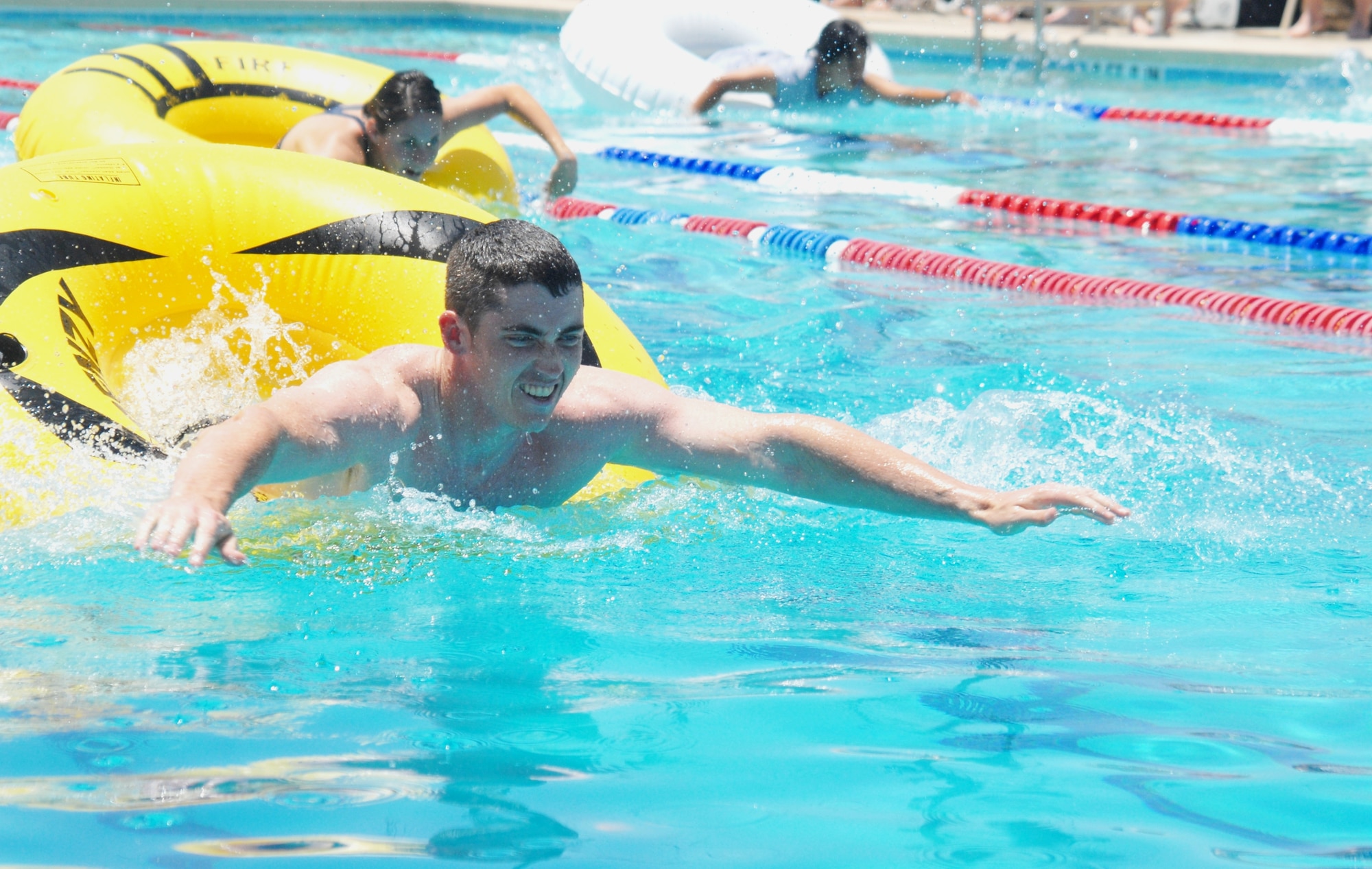 Airman 1st Class Richard Ring, 315th Training Squadron, takes the lead while competing in the individual tube race at McGarr Pool May 21 during the Wing Quarterly Sports Day. (U.S. Air Force photo/Connie Hempel)