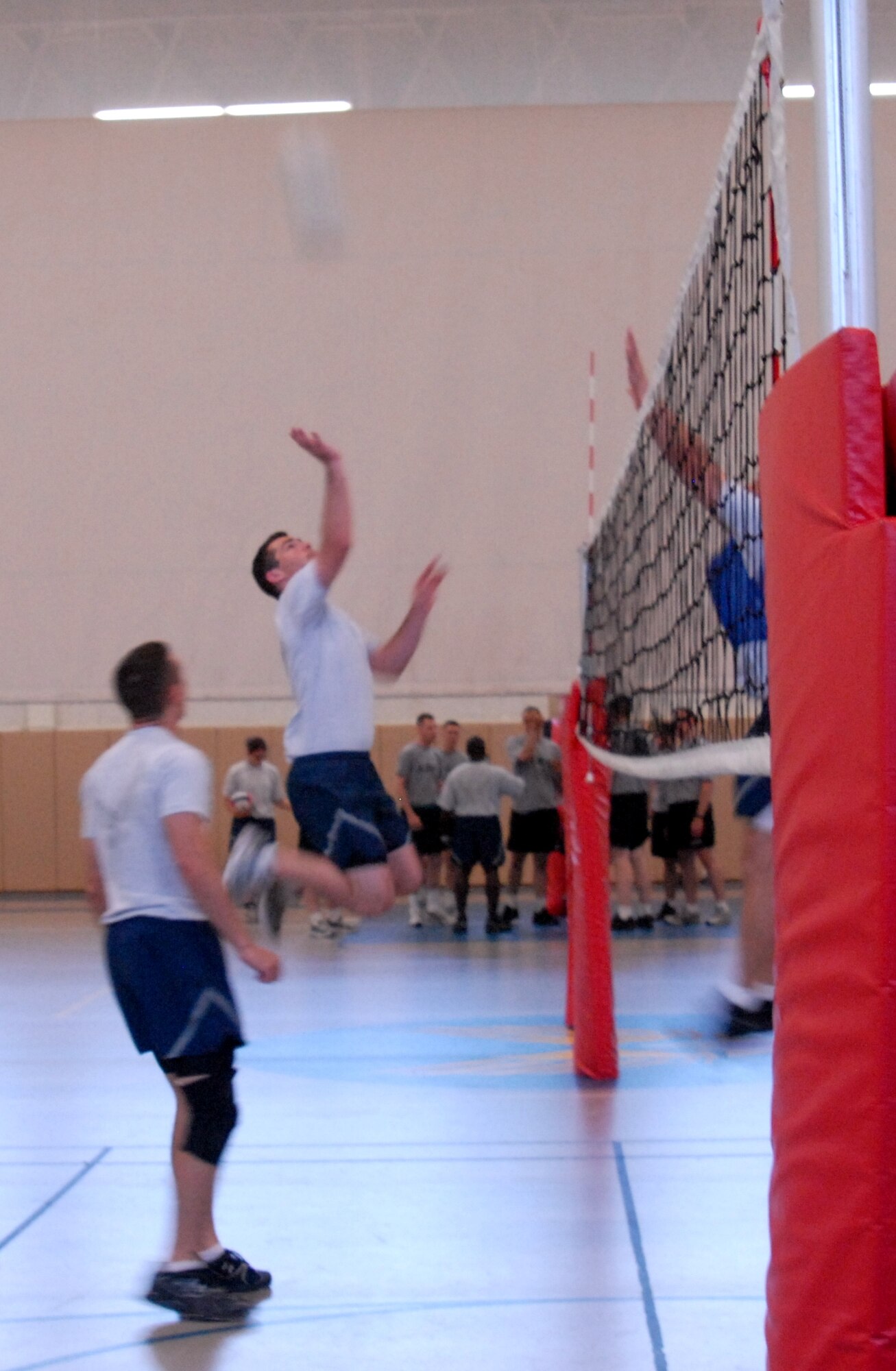 Airman 1st Class Matthew Arnold, 316th Training Squadron, gets ready to slam it over during a volleyball game against 315th Training Squadron at the Carswell Field House May 21 during the Wing Quarterly Sports Day. The 316th took 1st place at the volleyball event. (U.S. Air Force photo/Connie Hempel)