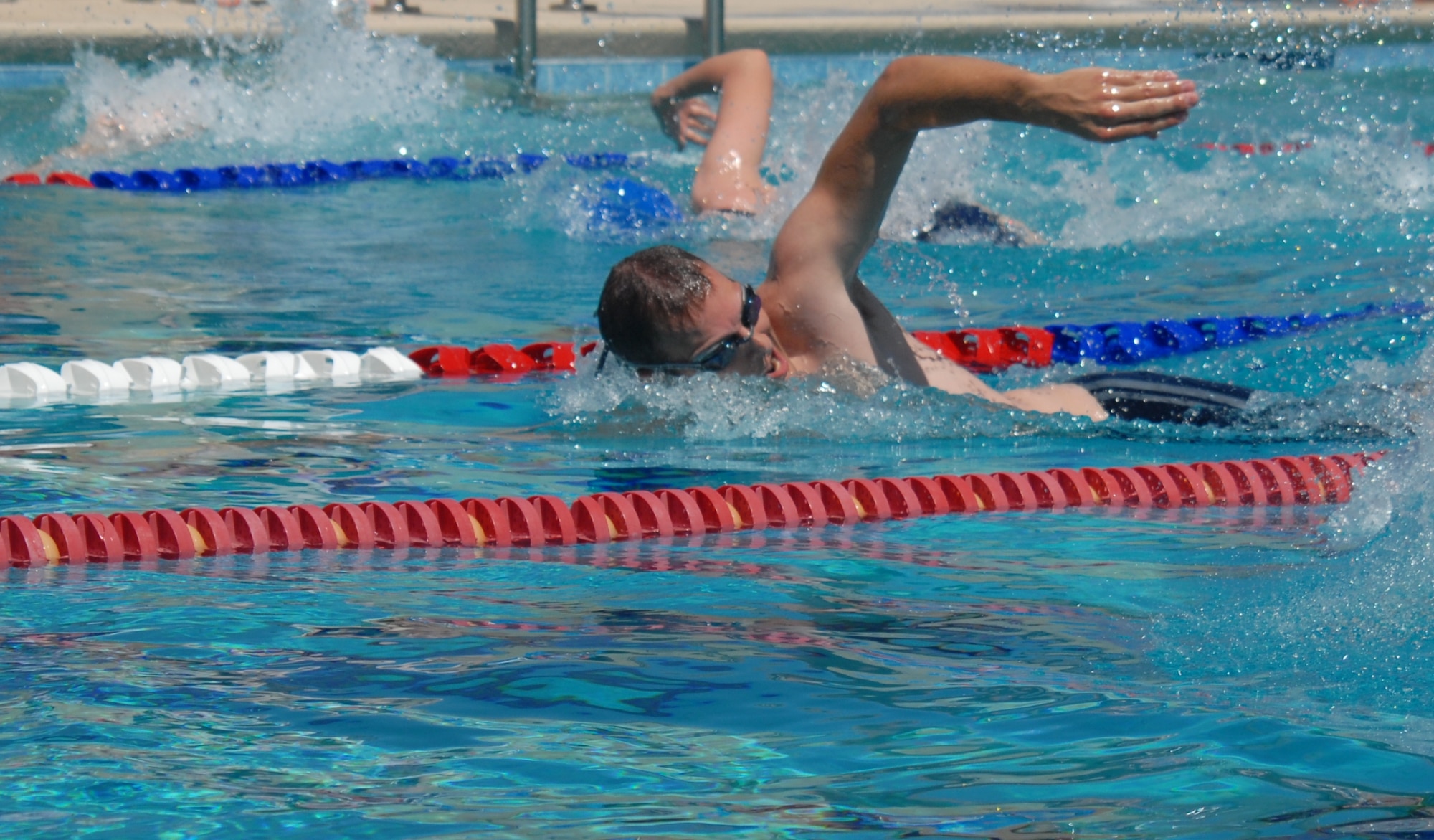 2nd Lt. Darrin Govan, 315th Training Squadron, competes during the first heat of the 50-meter freestyle at McGarr Pool May 21 during the Wing Quarterly Sports Day. (U.S. Air Force photo/Connie Hempel)