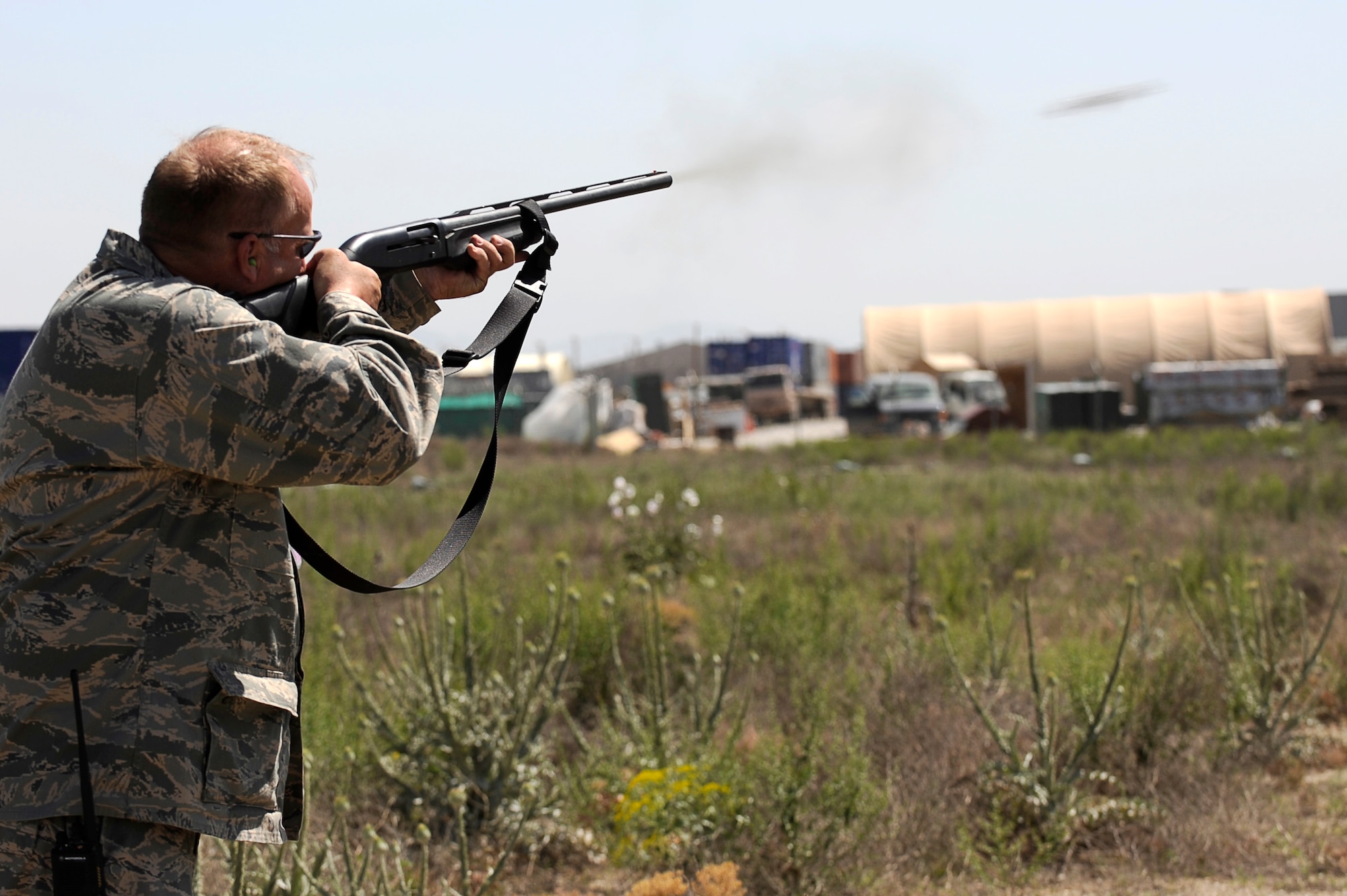 Mr. Todd Grimm, 455th Air Expeditionary Wing, Safety Office, fires his shotgun at birds flying near the flight line, May 20, 2010. He is a wildlife biologist with the U.S. Department of Agriculture, Wildlife Service program, working with the 455th Safety Office to keep wildlife from interfering with flying operations at Bagram Airfield, Afghanistan. Mr. Grimm is from Boise, Idaho. (U.S. Air Force photo by/ Master Sgt. Jeromy K. Cross/released)








