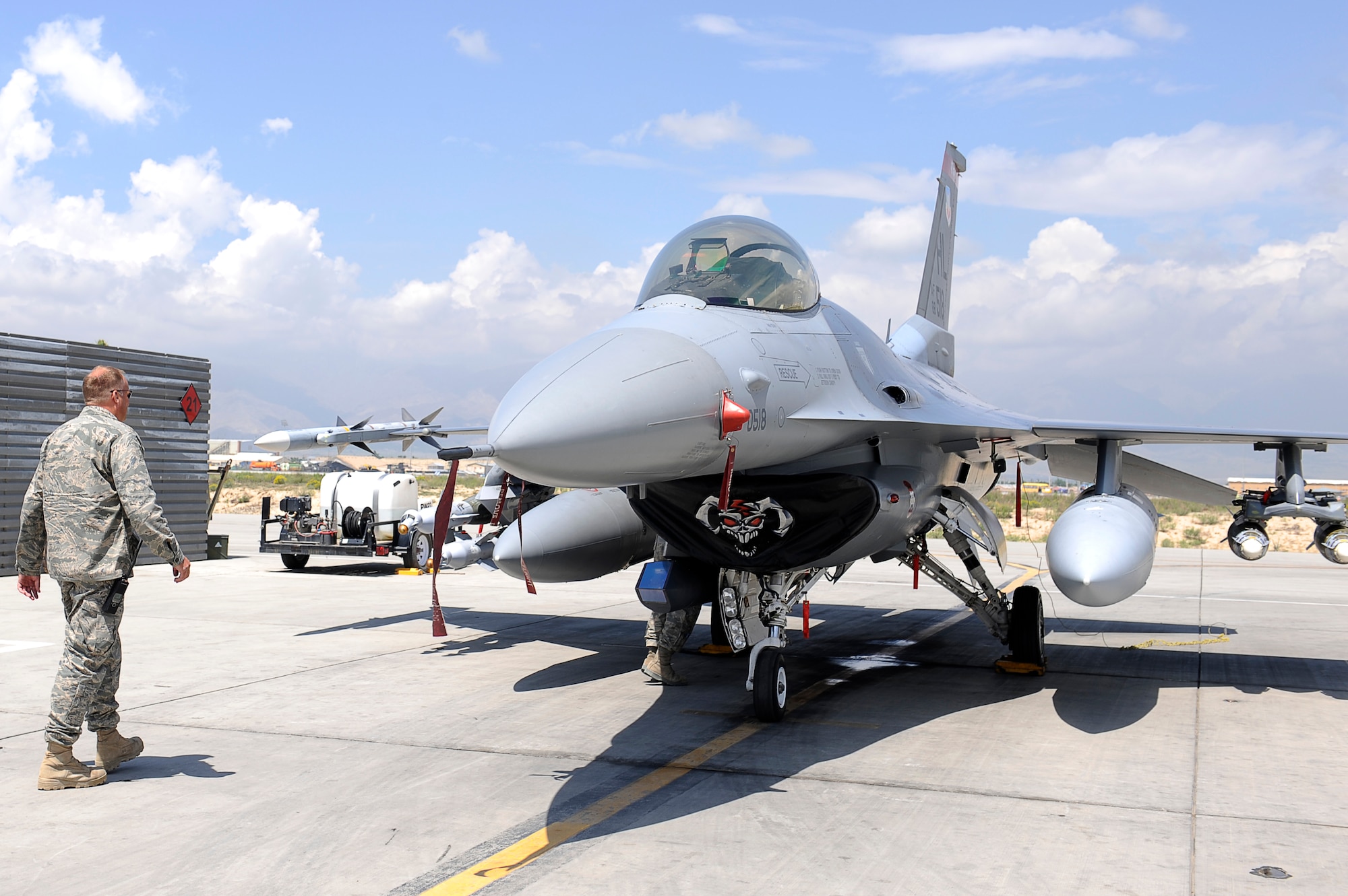 Mr. Todd Grimm, 455th Air Expeditionary Wing, Safety Office, looks into reports of birds nesting in F-16s, May 18, 2010. He is a Wildlife Biologist with the U.S. Department of Agriculture, Wildlife Service program, working with 455th Safety Office to keep wildlife from interfering with flying operations at Bagram Airfield, Afghanistan. Mr. Grimm is from Boise, Idaho. (U.S. Air Force photo by/ Master Sgt. Jeromy K. Cross/released)








