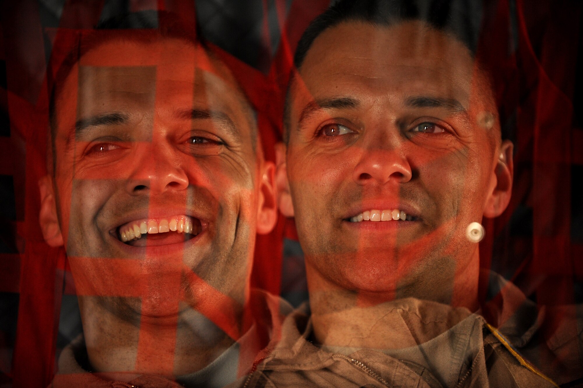 A double exposure of U.S. Air Force Capt. Larry Needham, a C-27J Spartan instructor pilot assigned to the 538th Air Expeditionary Advisory Squadron, jokes with fellow aircrew members while waiting for manifested passengers to arrive to the C-27 for transportation to Kabul International Airport, May 15, 2010, at Kandahar Airfield, Afghanistan.   (U.S. Air Force photo illustration/Staff Sgt. Manuel J. Martinez/released)  
