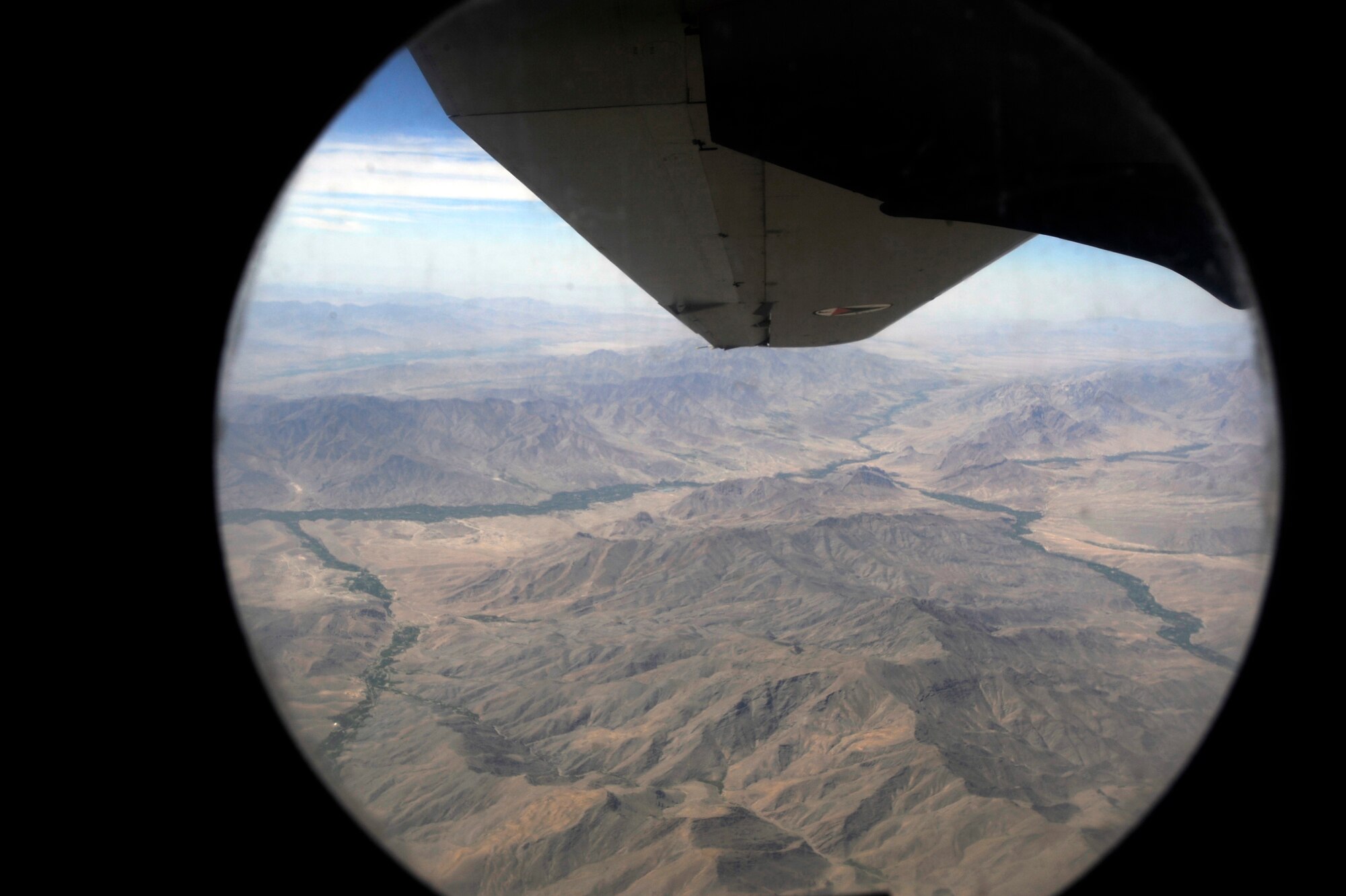 An aerial view from a window of a C-27J Spartan en-route to Kandahar Airfield, Afghanistan, to drop cargo off and pick-up passengers May 15, 2010.   (U.S. Air Force/ Staff Sgt. Manuel J. Martinez/released)  