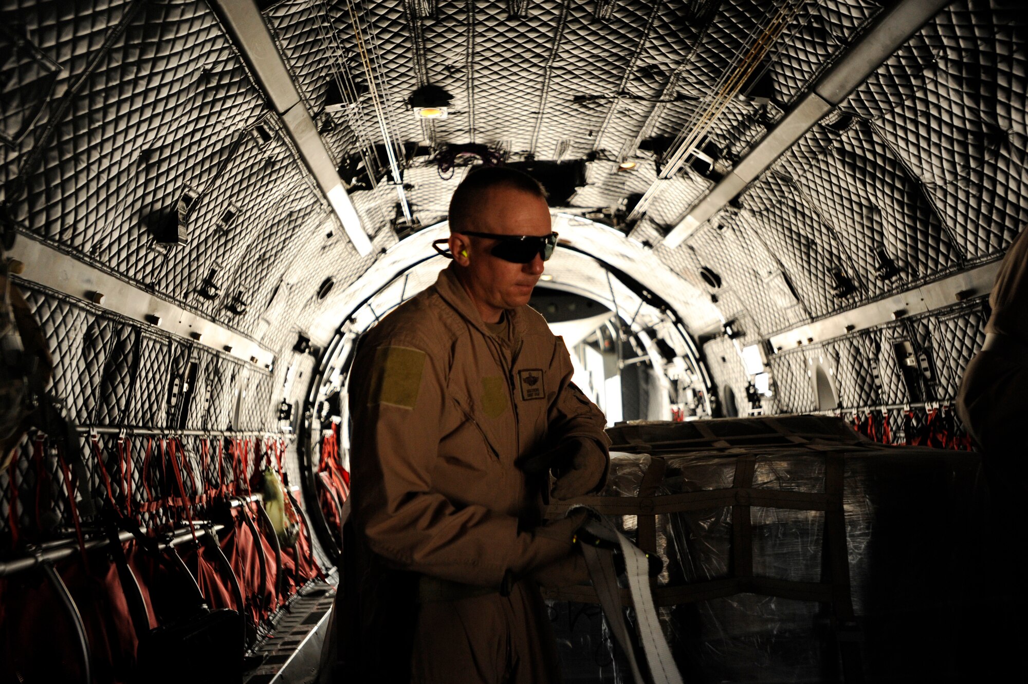Senior Master Sgt. Mike Crews, a C-27J Spartan loadmaster advisor assigned to the 538th Air Expeditionary Advisory Squadron, secures all loose cargo aboard a C-27 aircraft prior to take-off May 15, 2010, at Kabul International Airport, Afghanistan. "We are now fully manned and will be able to continue toward our goal of building a professional air force for Afghanistan," said Sergeant Crews, 538th AEAS superintendant, deployed from the 1st Operations Support Squadron at Hurlburt Field, Fla.  "Our team has already overcome some huge hurdles to accomplish some great things, now we just have to build on what we have already accomplished and keep it going." (U.S. Air Force/ Staff Sgt. Manuel J. Martinez/released)  
