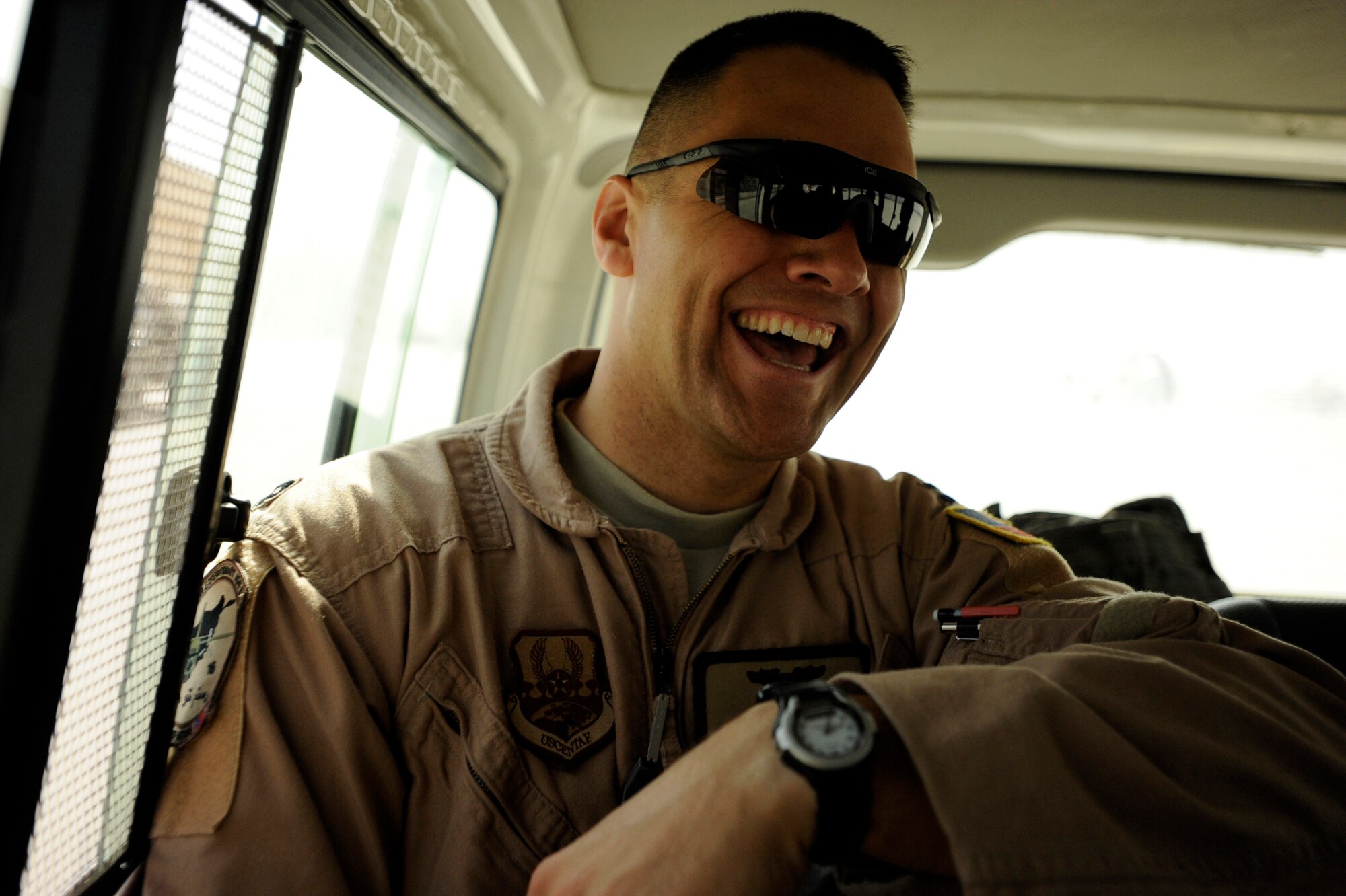 U.S. Air Force Capt. Larry Needham, a C-27J Spartan instructor pilot assigned to the 538th Air Expeditionary Advisory Squadron, jokes with fellow aircrew members enroute to a C-27 aircraft for an operational mission, May 15, 2010, at Kabul International Airport, Afghanistan. "This is a great opportunity to work with some fantastic folks," said Capt. Needham, who deployed from Laughlin Air Force Base, Texas, a little over a month ago. "I have already begun to forge some relationships with people that I foresee lasting a lifetime.  Looking at what we have already accomplished I feel the time we will invest here will have a positive effect on the long term security of Afghanistan." (U.S. Air Force/ Staff Sgt. Manuel J. Martinez/released)  
